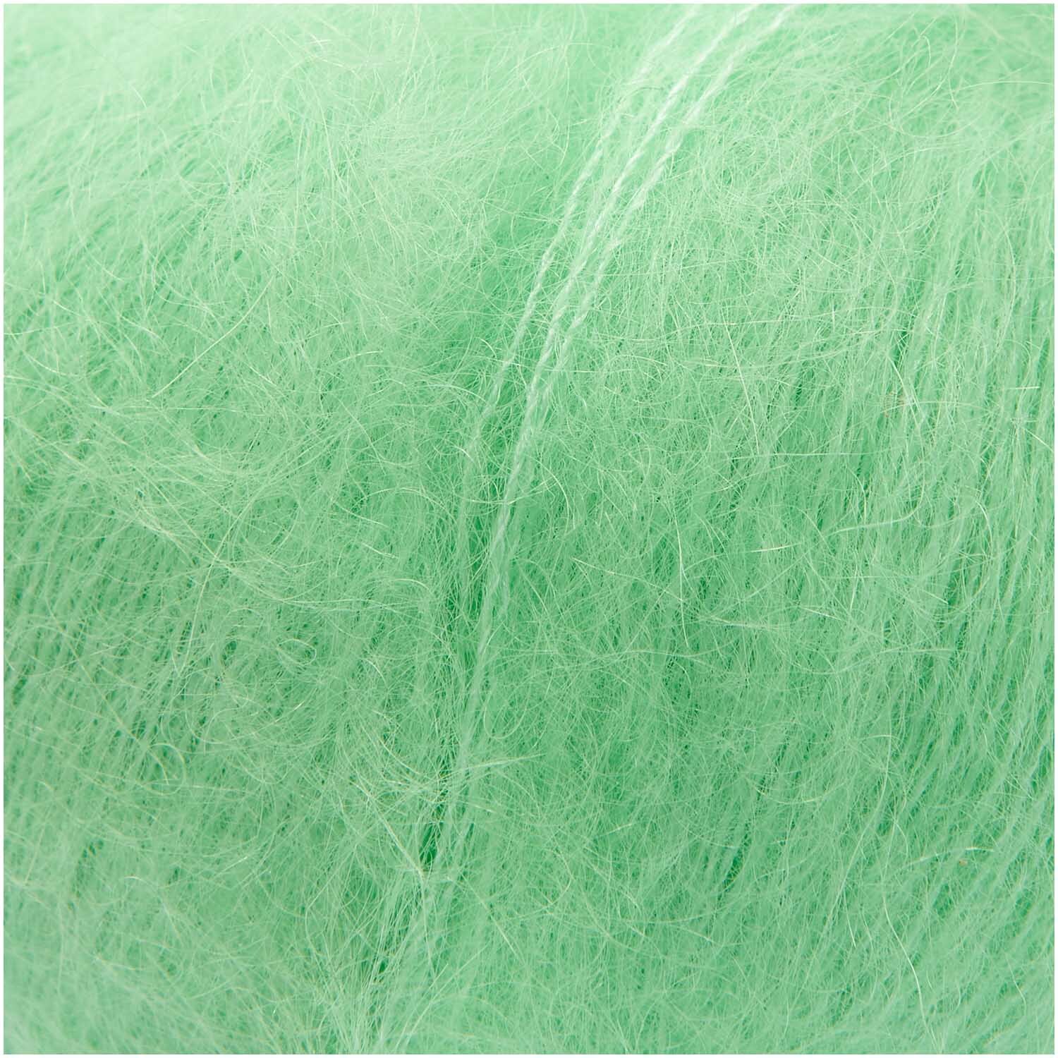 Essentials Super Kid Mohair Loves Silk von Rico Design in leuchtendem Neongrün, 25g Knäuel mit 200m Länge, ideal für weiche Strickprojekte.
