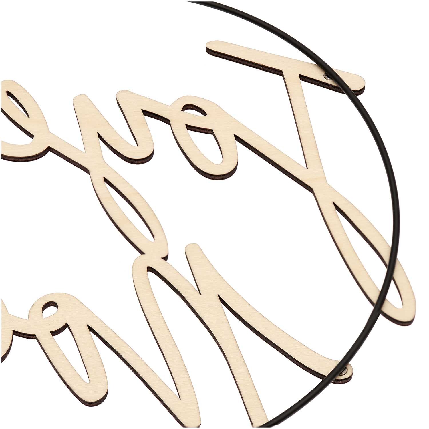Holzschriftzug magnetisch "Joyeux Noël" von Rico Design, dekorativ in einem schwarzen Metallring.