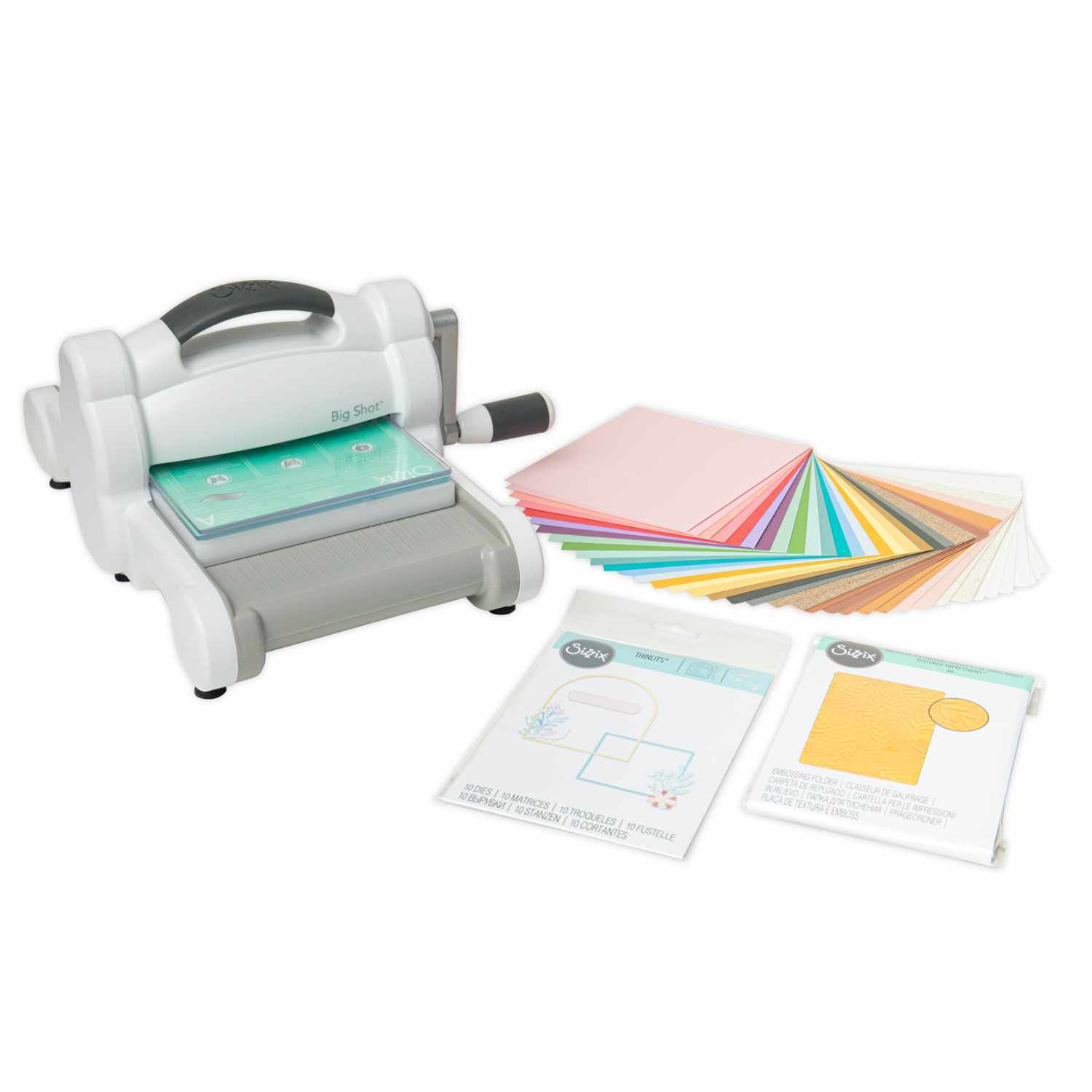 Big Shot Starter Set: Stanzmaschine mit grauem Gehäuse, buntem Papierstapel und Anleitungen. Ideal für kreative Bastelprojekte.