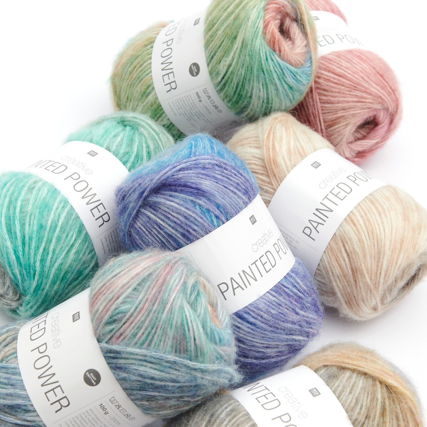 Creative Painted Power: Bunte Wollknäuel in Pastelltönen von Rico Design, ideal für Strickprojekte.