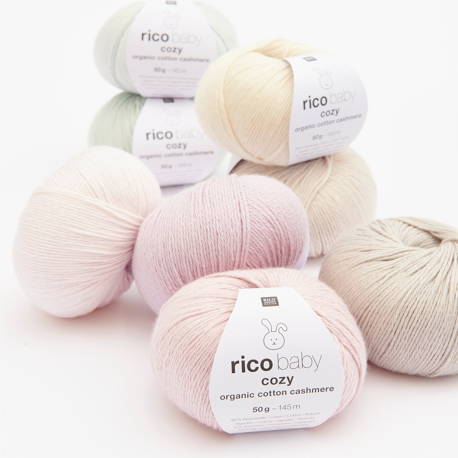 Baby Cozy Organic Cotton Cashmere Sortiment: Weiche Garnknäuel in sanften Pastelltönen, ideal für empfindliche Babyhaut.