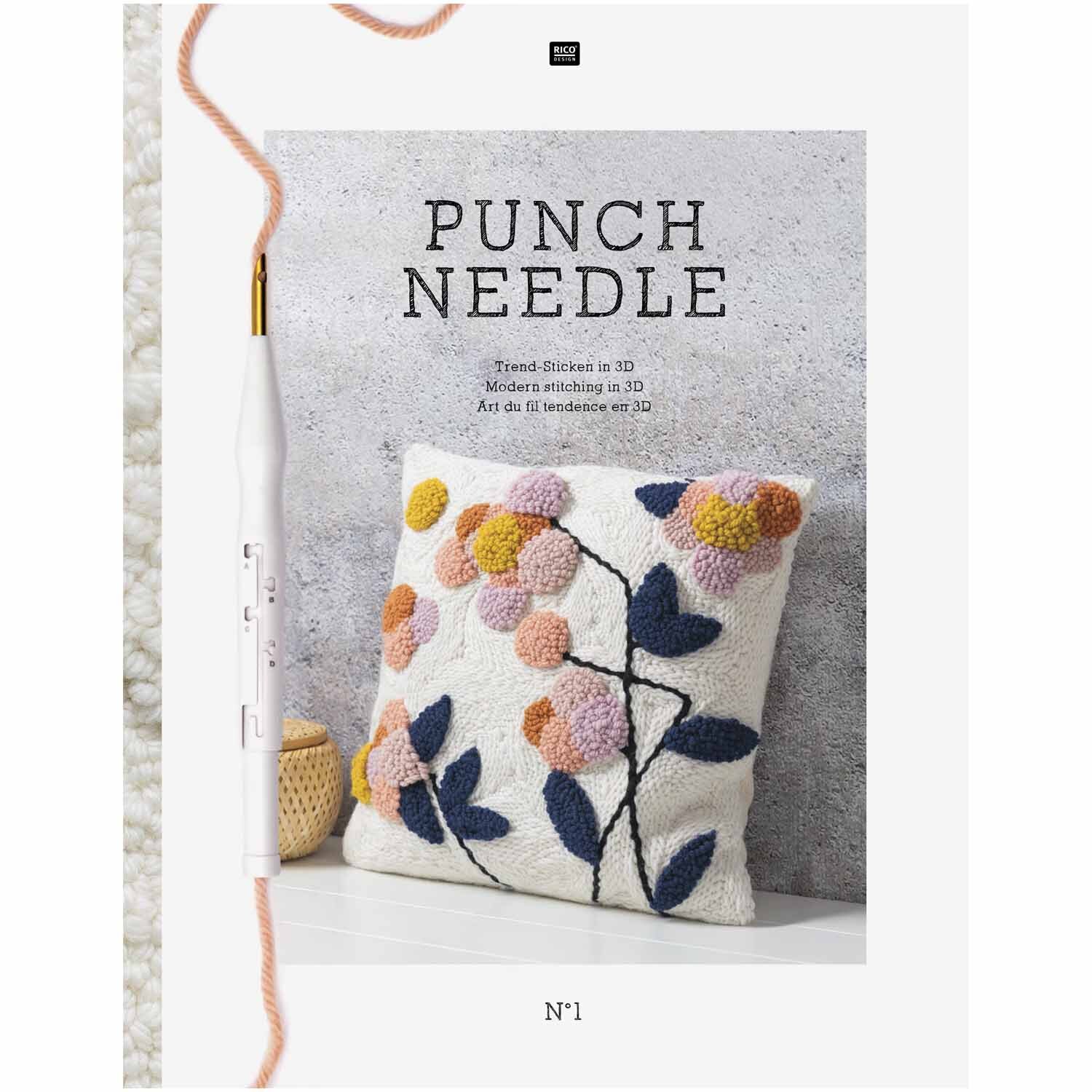 Stickbuch Punch Needle: Kissen mit buntem Blumenmuster, präsentiert von Rico Design, auf grauem Hintergrund.