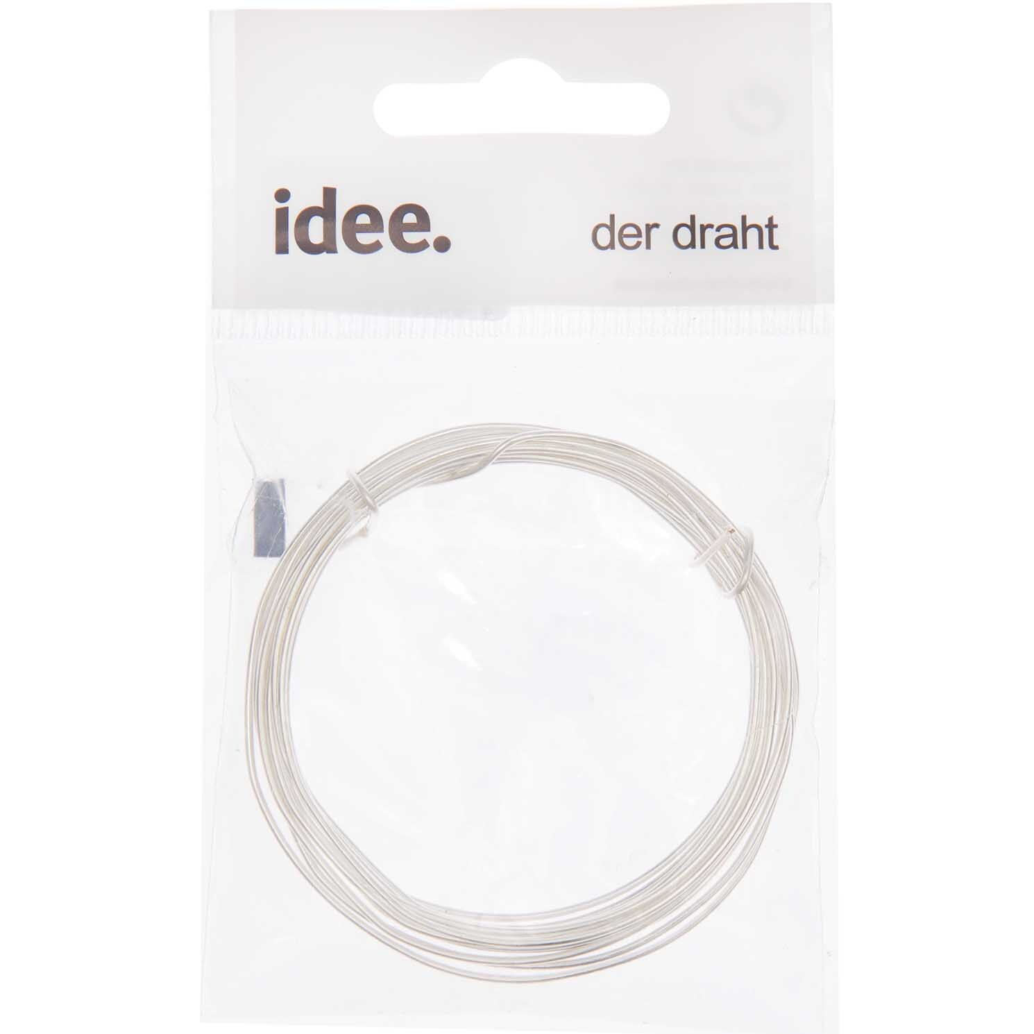 Silberdraht von preissler in einer transparenten Verpackung mit der Aufschrift "idee. der draht". Ideal für kreative Bastelprojekte.
