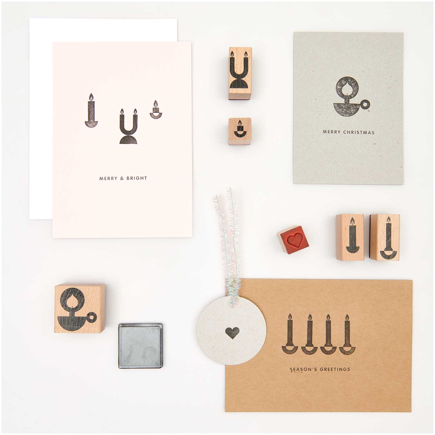 Paper Poetry Stempelset Kerzen, 7-teilig, von Rico Design, zeigt Kerzenmotive auf Karten.