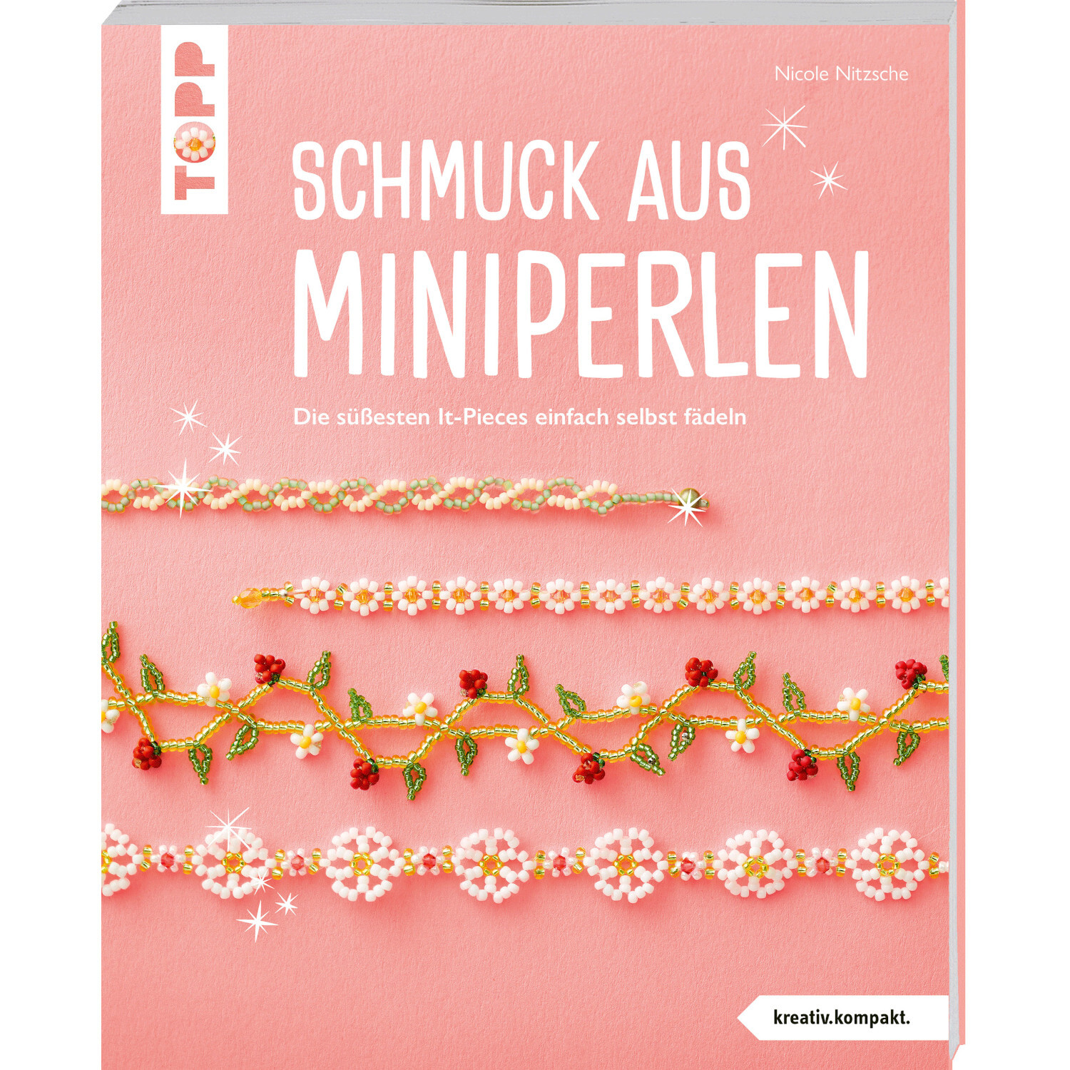 Schmuck aus Miniperlen: Kreatives Buch von TOPP mit Anleitungen für Perlenschmuck auf rosa Hintergrund.