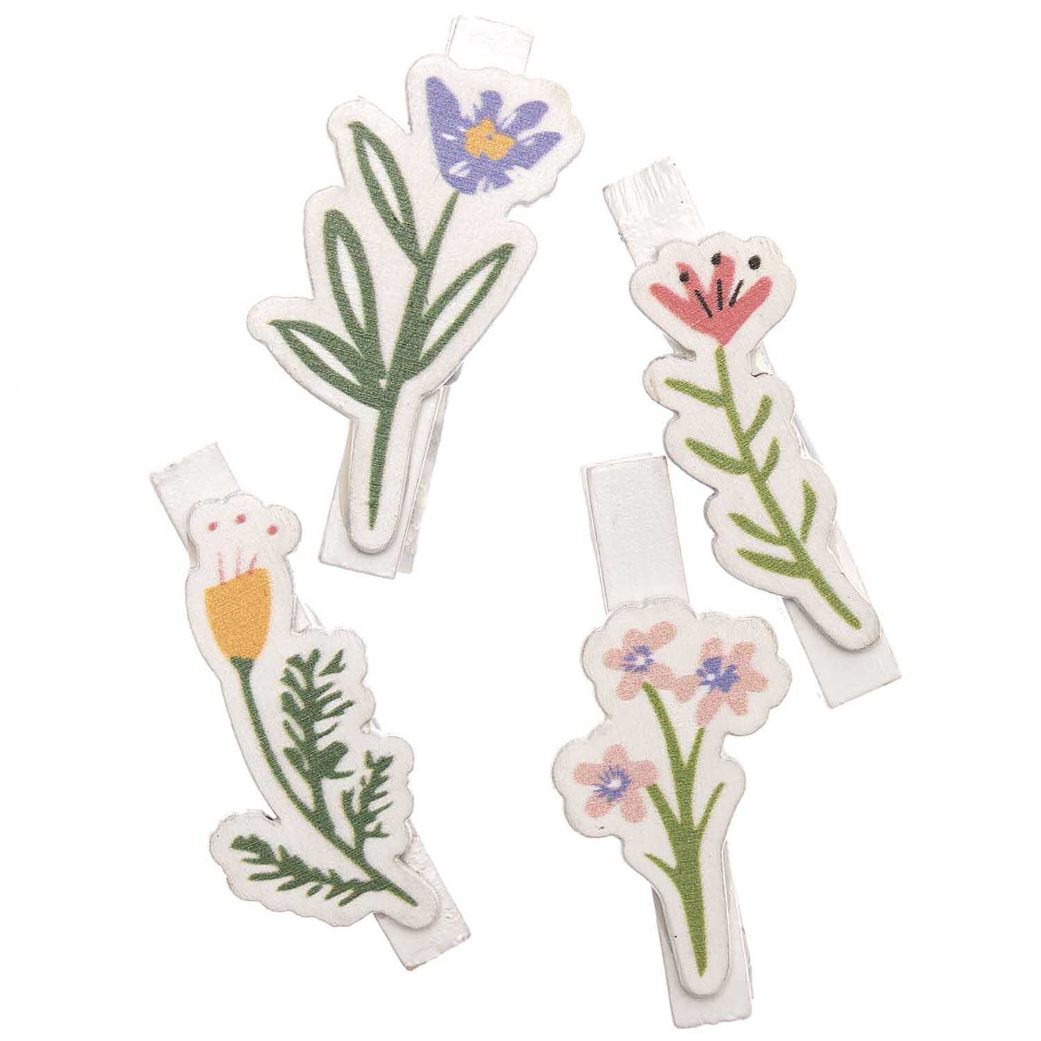 Dekoklammern Blumen Mix weiß 4 Stück: Vier bunte Blumenklammern von Rico Design, ideal für kreative Dekorationen.