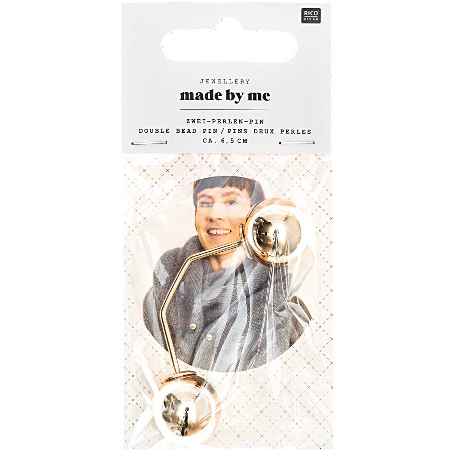 Zwei-Perlen-Pin 65mm von Rico Design in Gold, verpackt auf einer Karte mit lächelndem Gesicht.