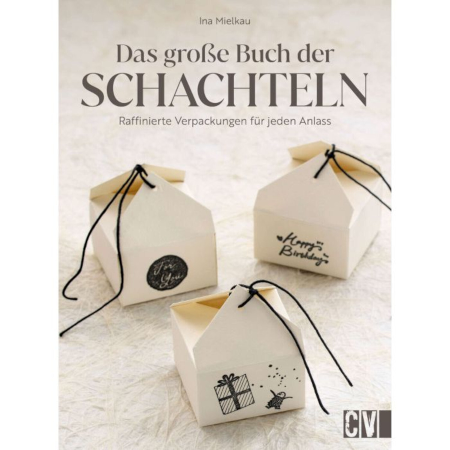 Das große Buch der Schachteln zeigt drei kunstvoll gestaltete Geschenkboxen mit schwarzen Bändern.