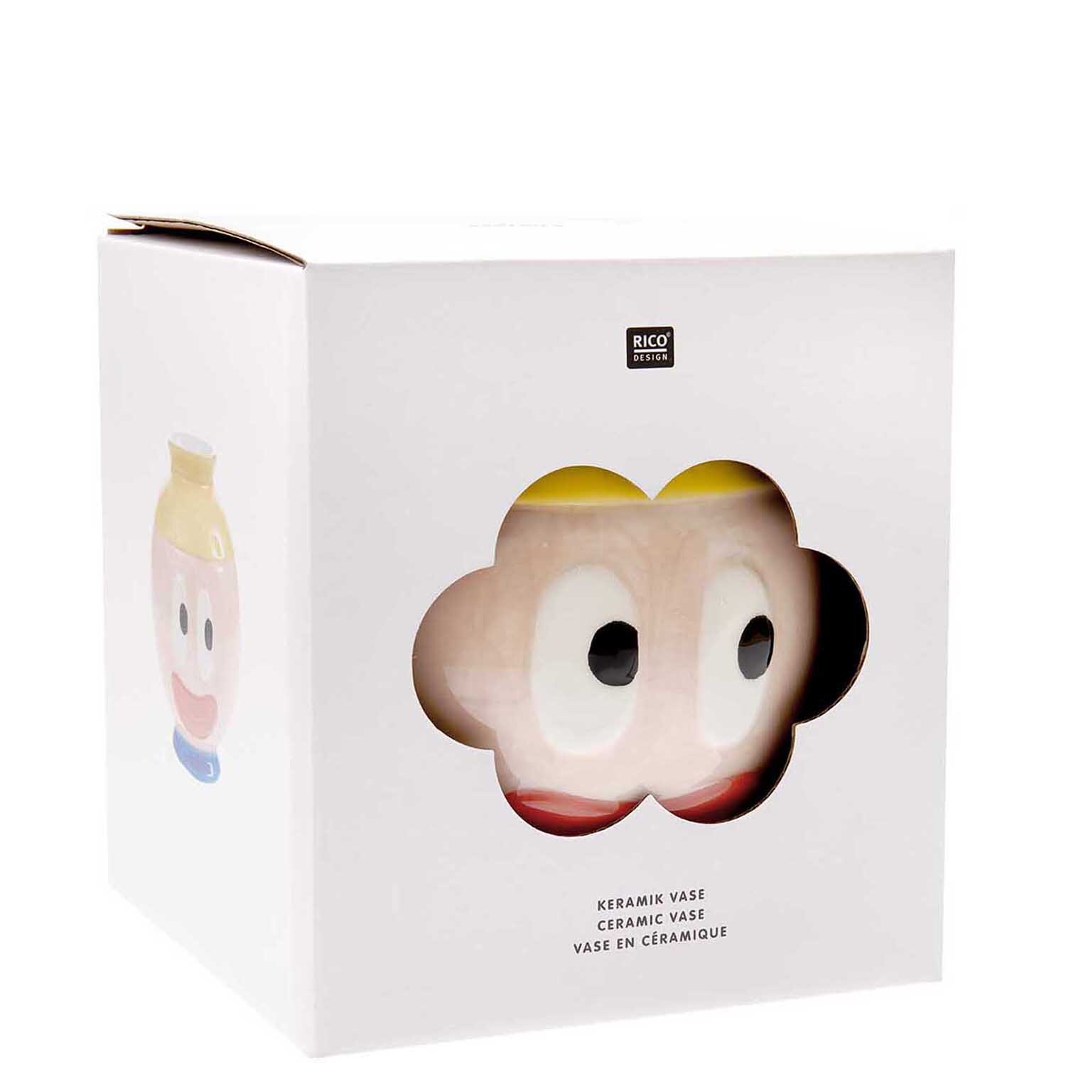Rico Design x Redfries Keramik Vase Eye Candy in einer weißen Verpackung mit buntem, cartoonartigem Gesichtsmotiv.