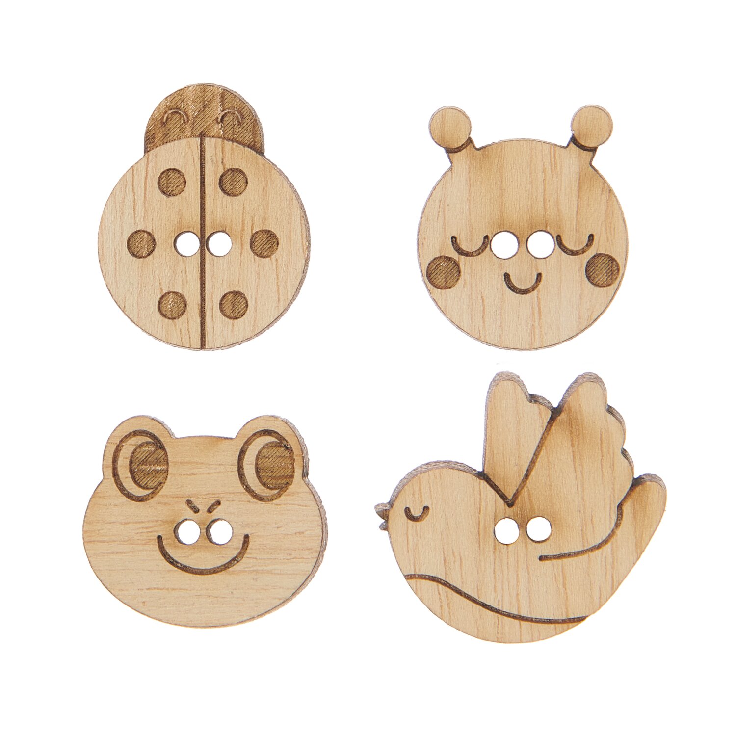 Vier Knöpfe in Tierform aus naturbelassenem Holz.