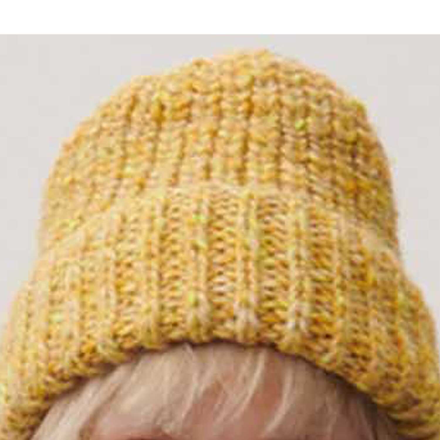 Fashion Alpaca Tweed chunky Mütze in Gelb von Rico Design, gestrickt mit weicher Struktur.