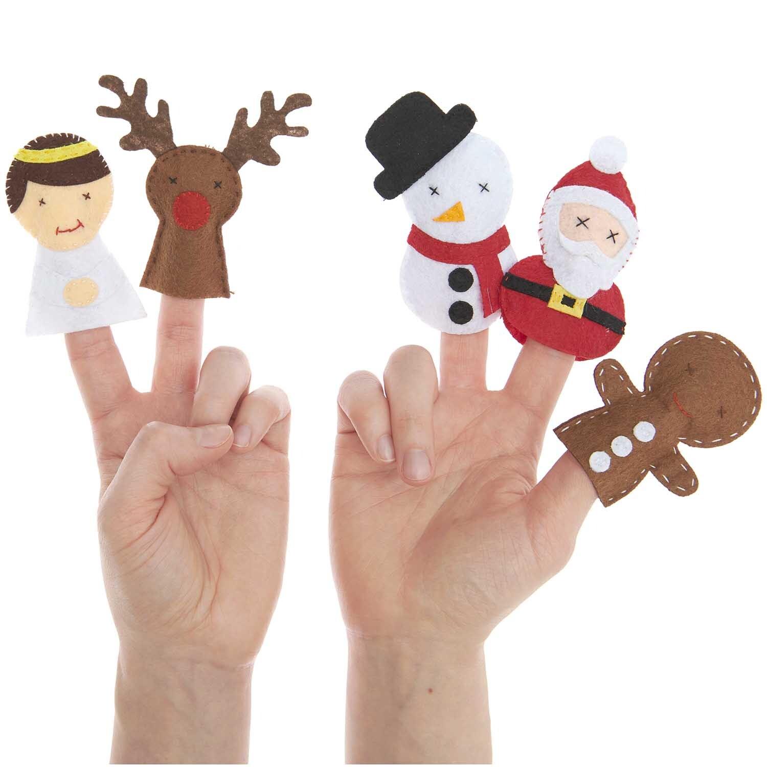 Bastelset Filz Fingerpuppen Weihnachten mit Engel, Rentier, Schneemann, Weihnachtsmann und Lebkuchenmann von Rico Design auf Fingern.