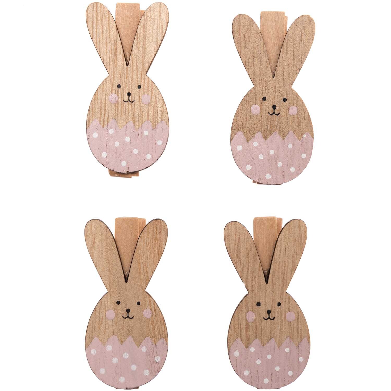 Dekoklammern Osterhase 4 Stück: Vier hölzerne Klammern in Hasenform mit rosa Details von Rico Design.