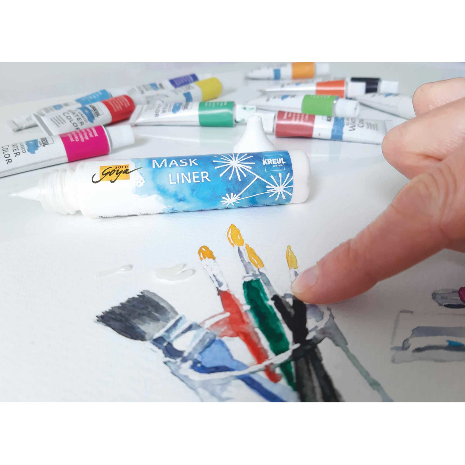 Mask Liner für Aquarellmalerei 25ml von KREUL in Blau, umgeben von bunten Farbtuben.