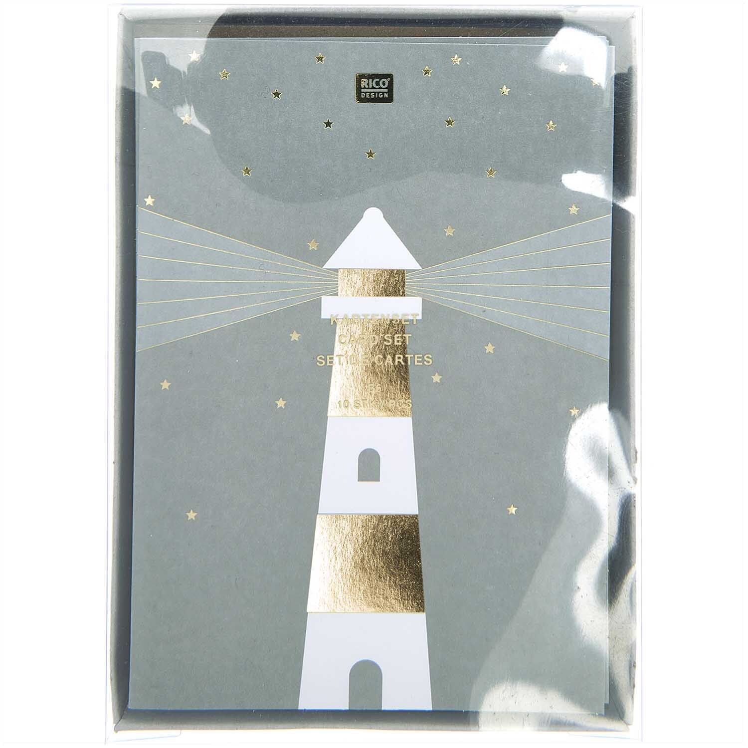 Paper Poetry Kartenset Leuchtturm von Rico Design, 20-teilig, zeigt einen stilisierten Leuchtturm auf grauem Hintergrund mit goldenen Akzenten.