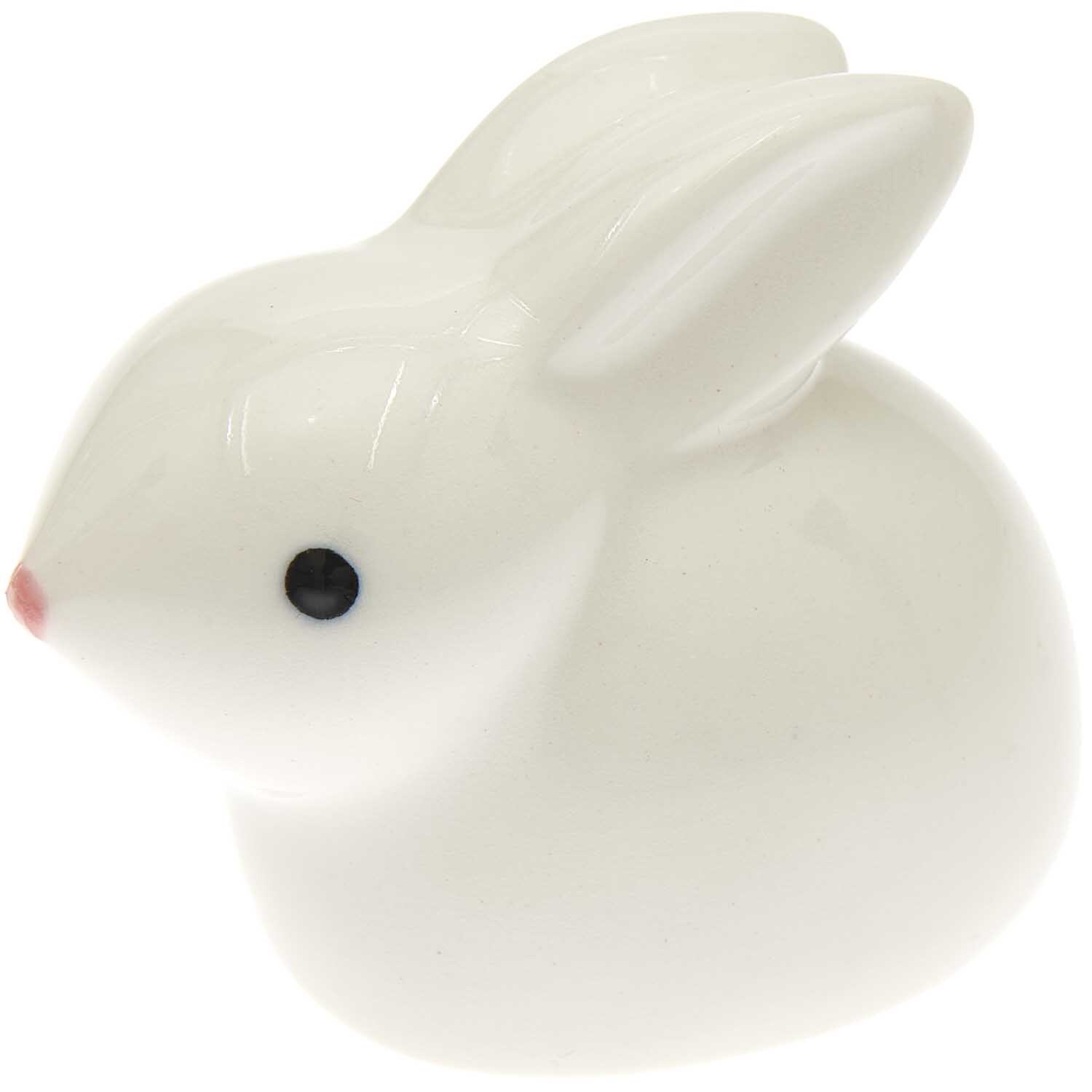 Porzellan Hase hockend von Rico Design, detailreich und elegant, ideal für Dekorationen.
