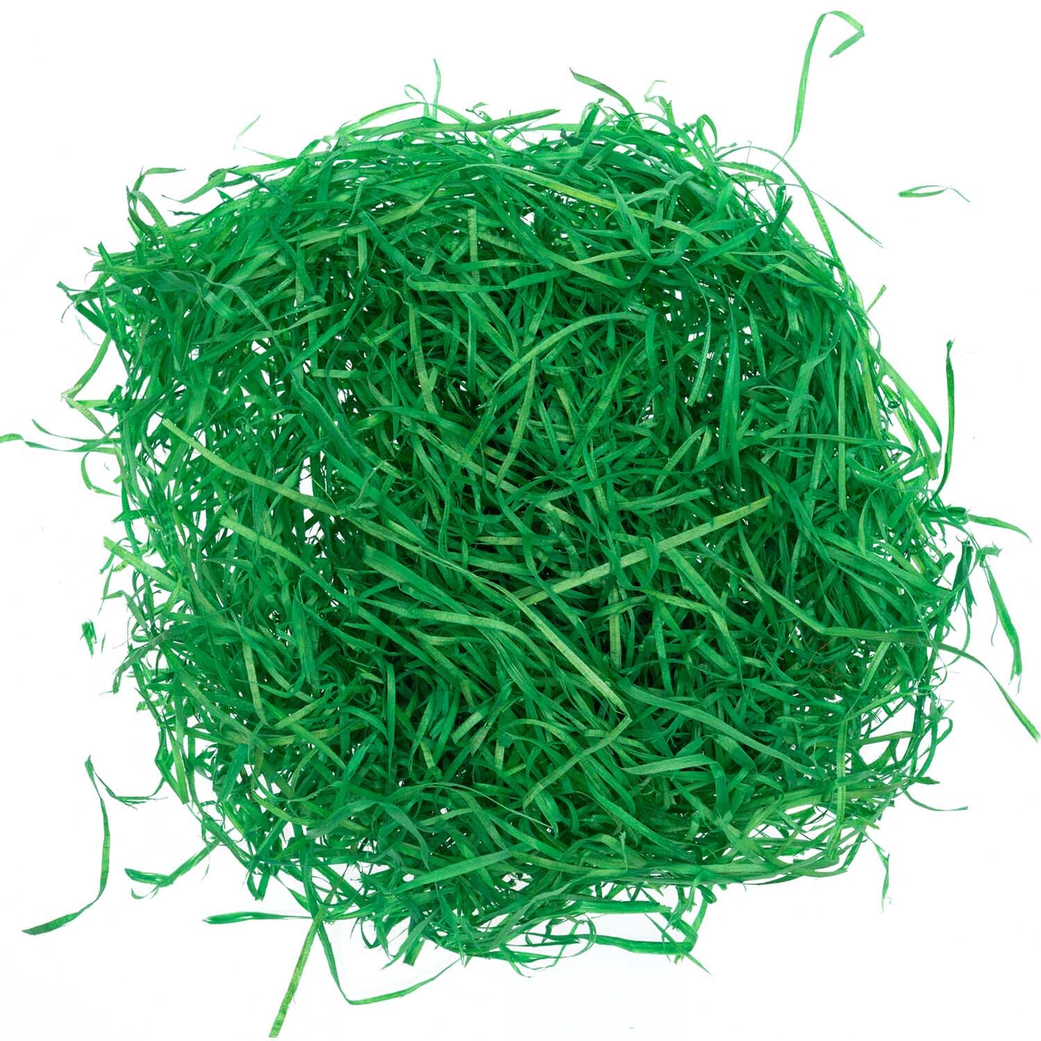 Dekogras grün 20g: Ein dichter Haufen grüner Dekograsfasern von idee. Creativmarkt, ideal für kreative Projekte.