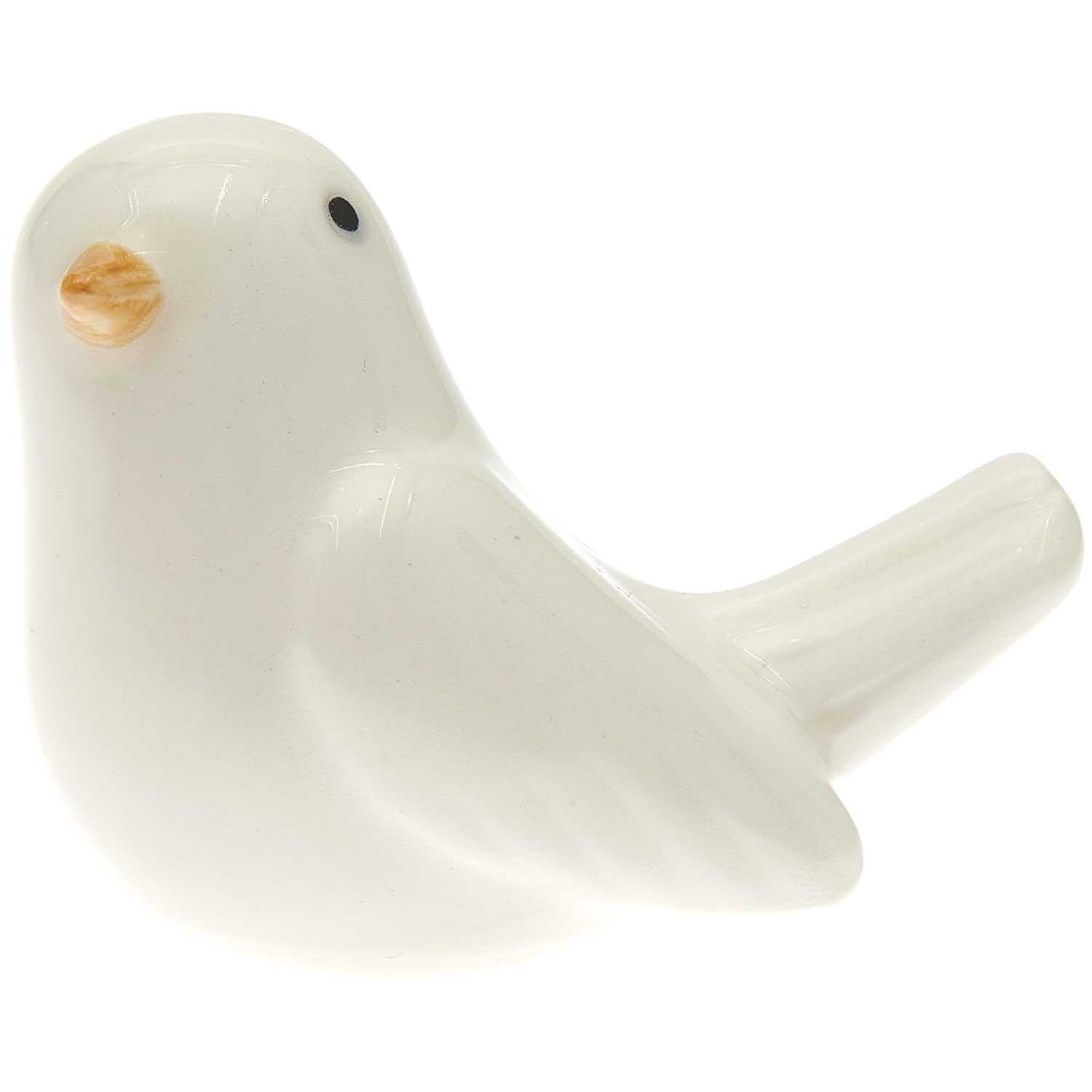 Porzellan Vogel weiß 6,1x3,7x5cm von Rico Design. Elegante Figur eines Vogels mit orangefarbenem Schnabel.