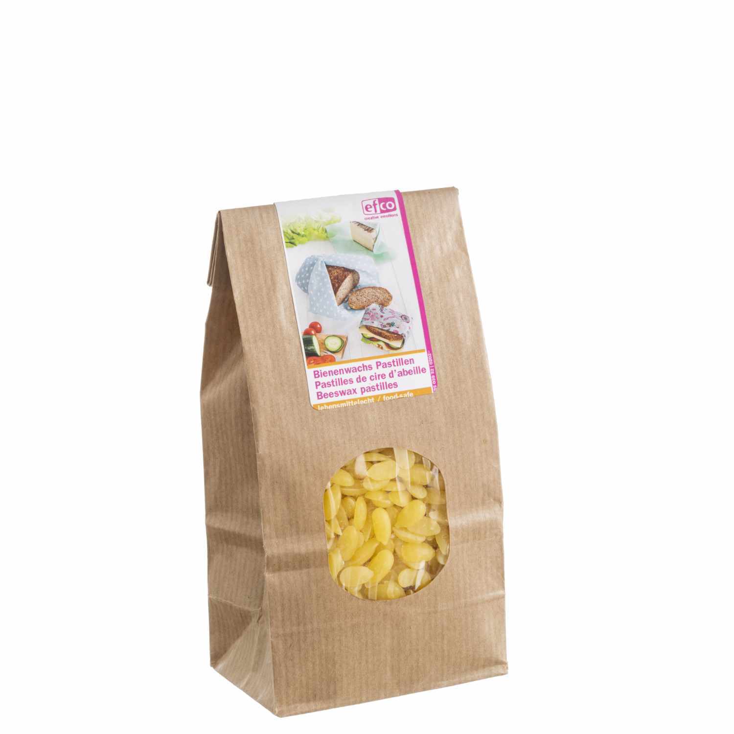 Bienenwachspastillen von efco in einer braunen Papiertüte mit Sichtfenster, ideal für DIY-Projekte.