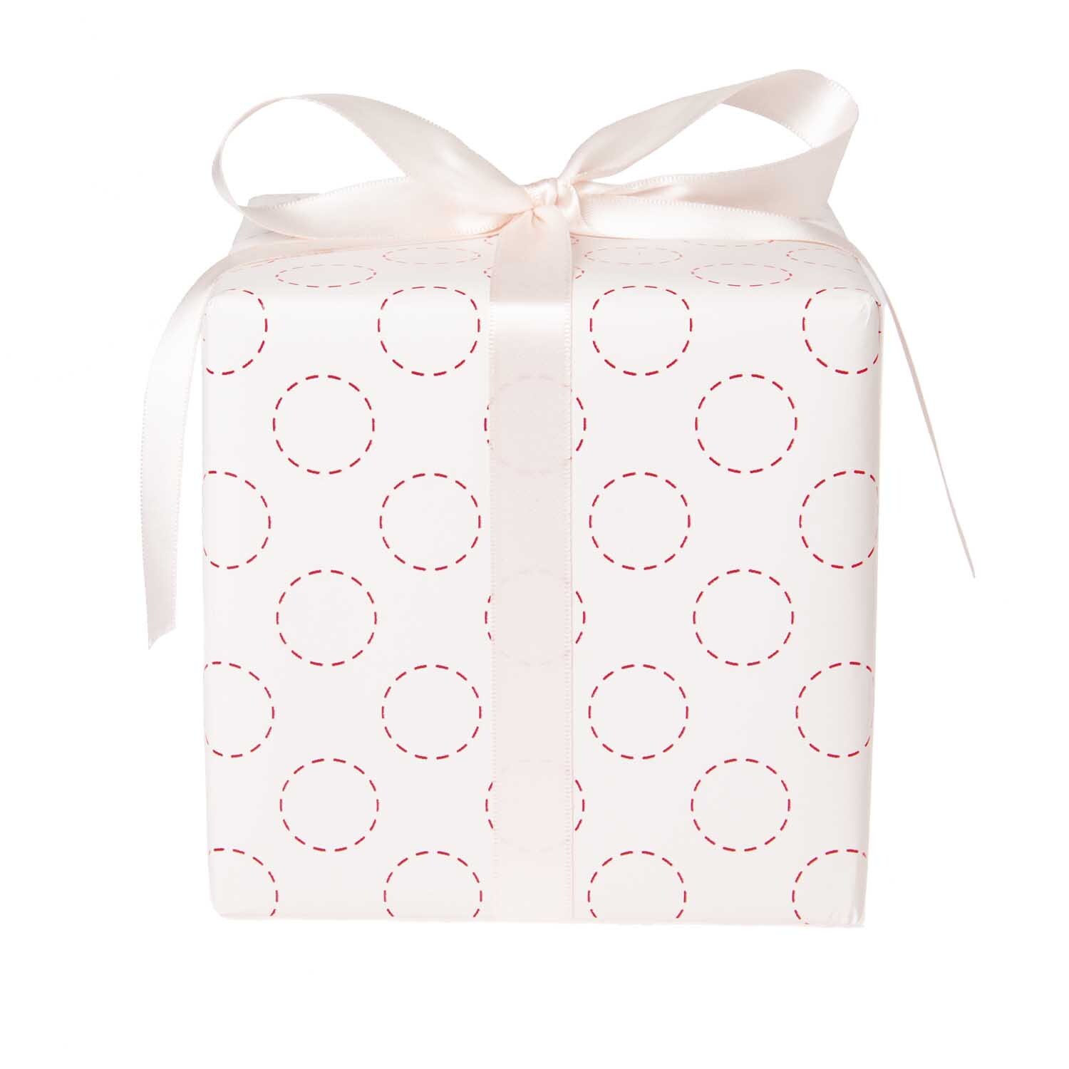 Paper Poetry Geschenkpapier Jardin Japonais mit Kreismuster, dekoriert als Geschenk mit Schleife.