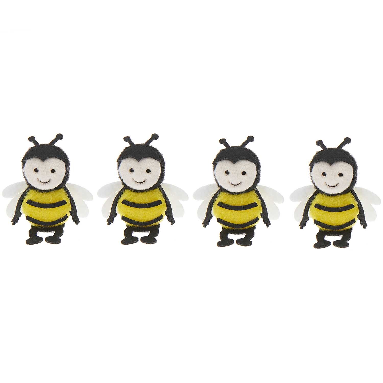 Pompon Biene: Vier gelbe und schwarze Bienen-Pompons von Rico Design, 5x3cm, ideal für Bastelprojekte.