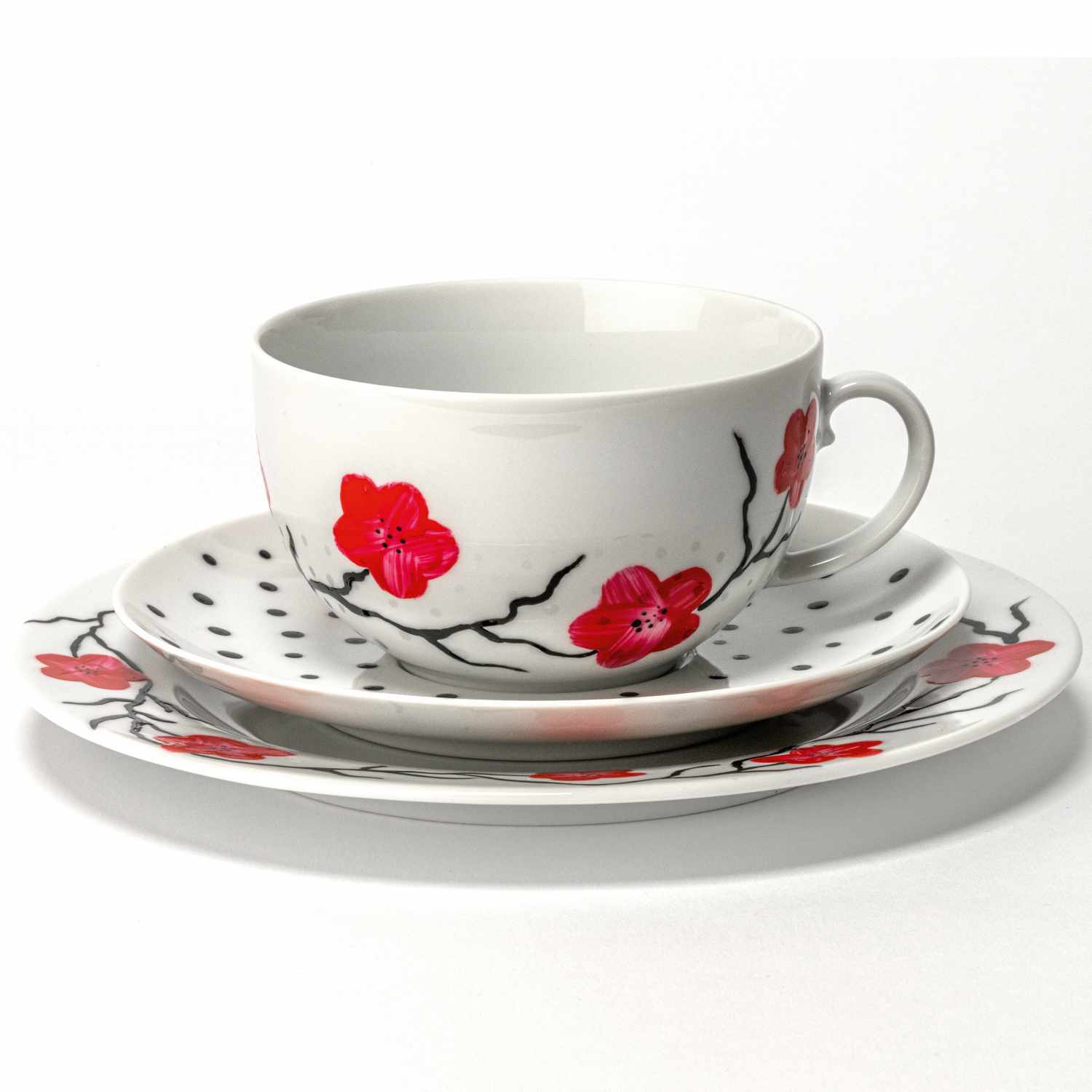 Porcelain & Glass Starterset glossy, 7-teilig, zeigt eine Tasse und Teller mit roten Blumenmotiven. Ideal für stilvolle Tischdekoration.