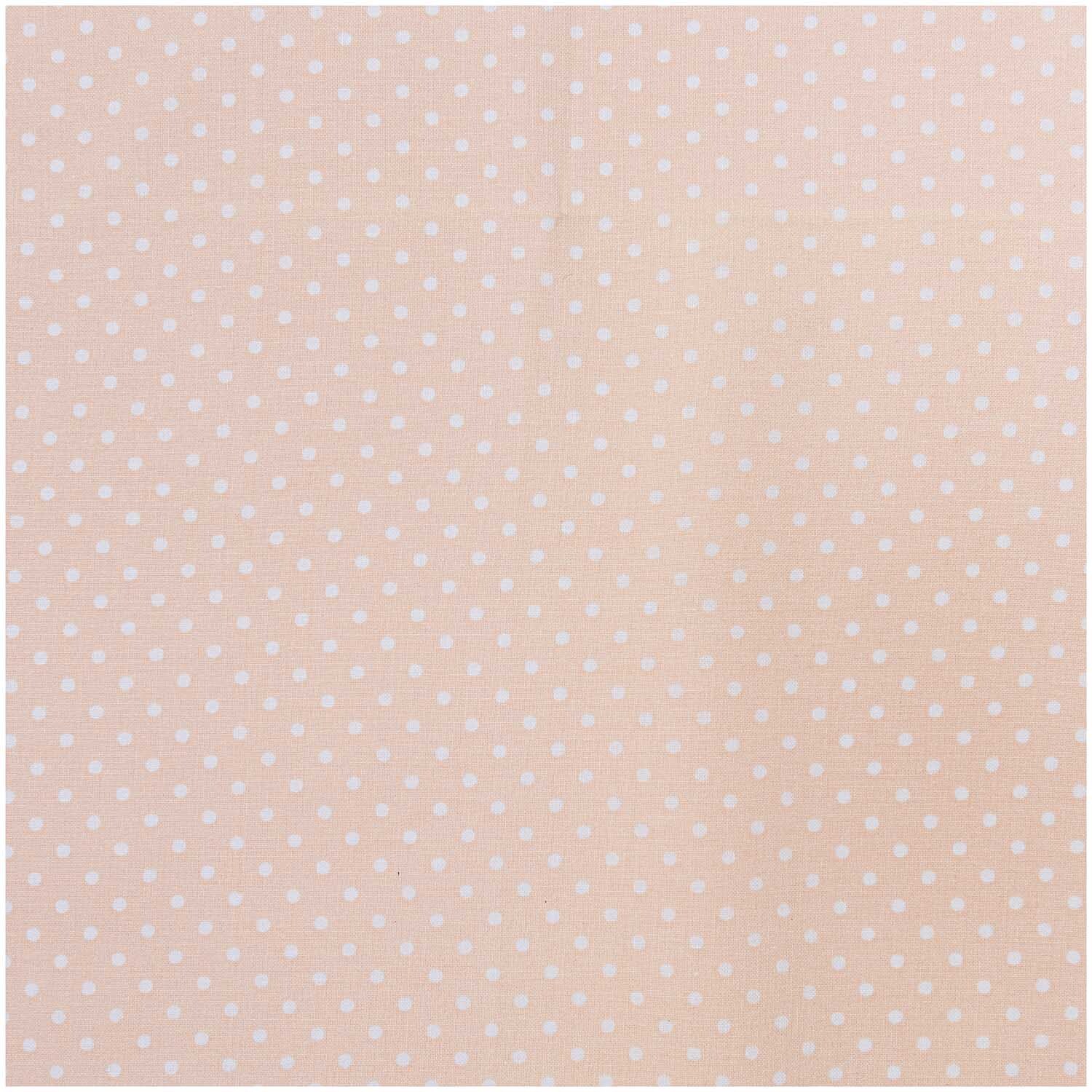 Stoff Punkte klein apricot-weiß 140cm von Rico Design zeigt ein zartes Punktmuster auf apricotfarbenem Hintergrund.