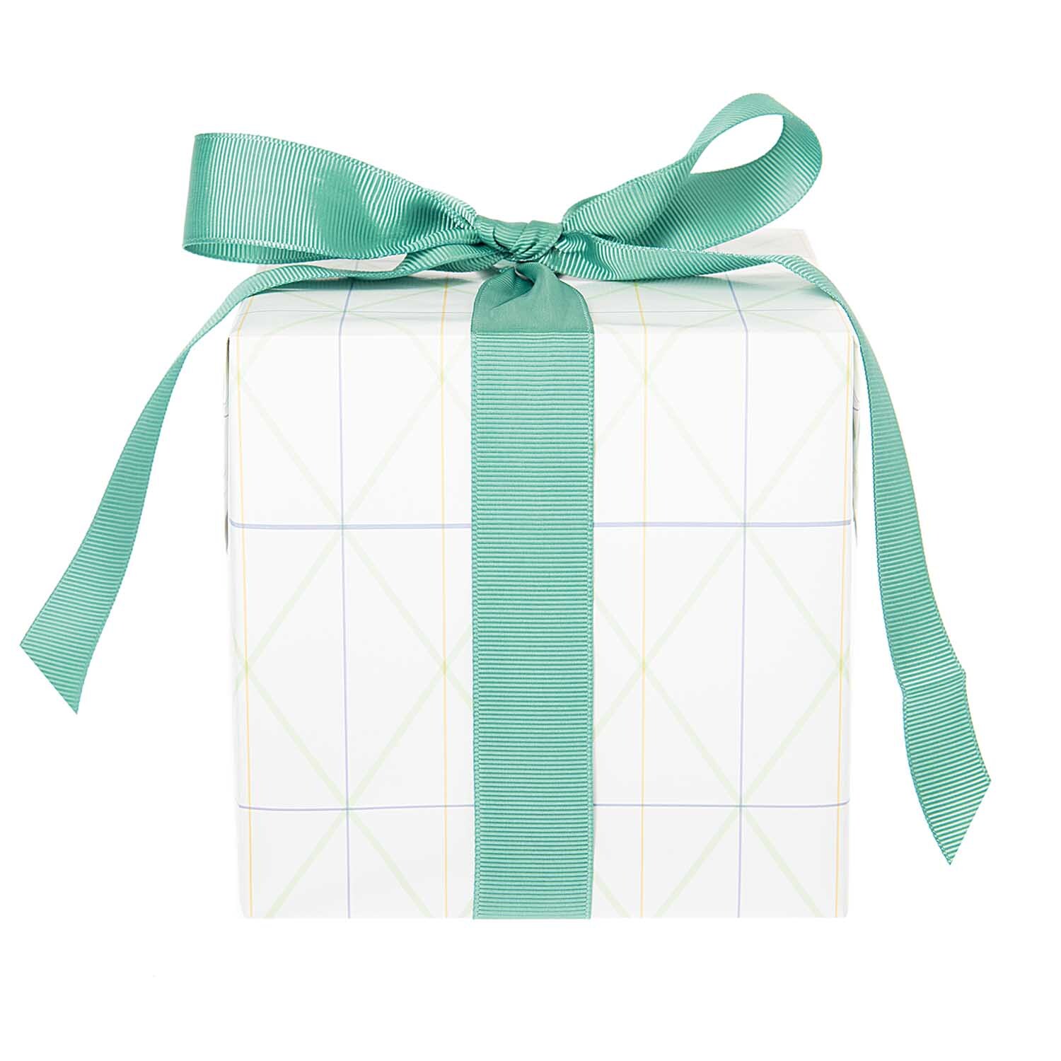 Paper Poetry Geschenkpapier Bunny Hop Raster zeigt ein Geschenk mit grünem Band, ideal für stilvolle Verpackungen.