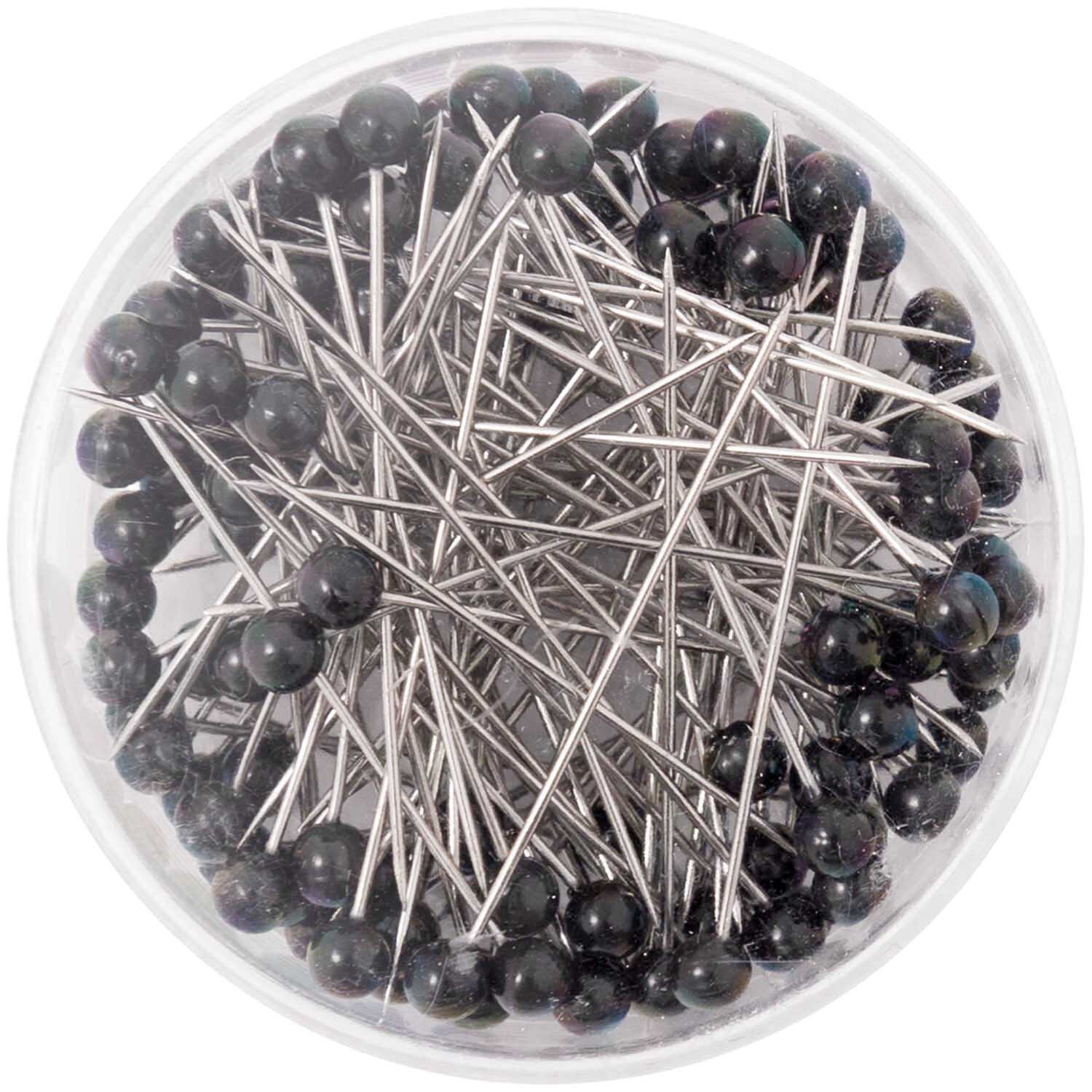 Pins schwarz 100 Stück: Eine runde Box mit schwarzen Stecknadeln von Rico Design, ideal für Näharbeiten.