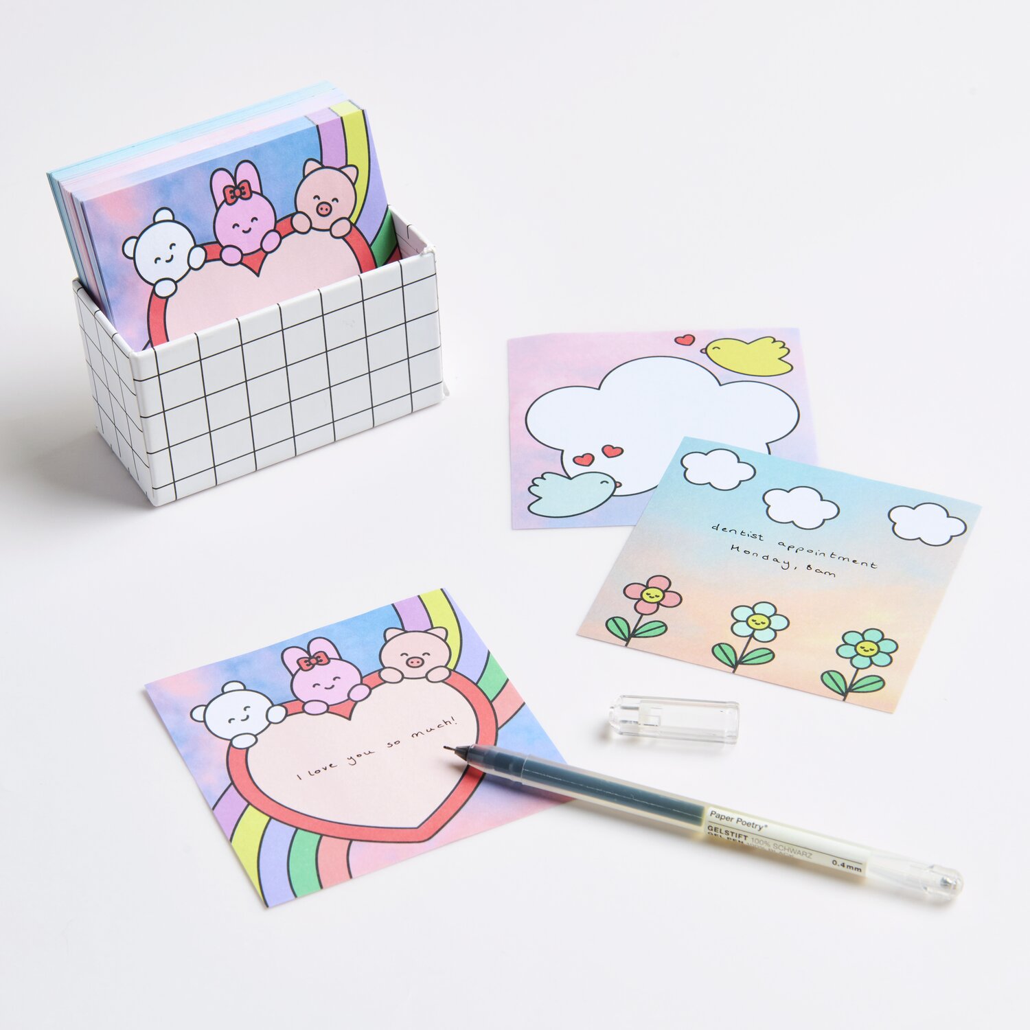 Paper Poetry Notizzettel-Box Chingu mit bunten, illustrierten Zetteln und einem Stift. Ideal für kreative Notizen.