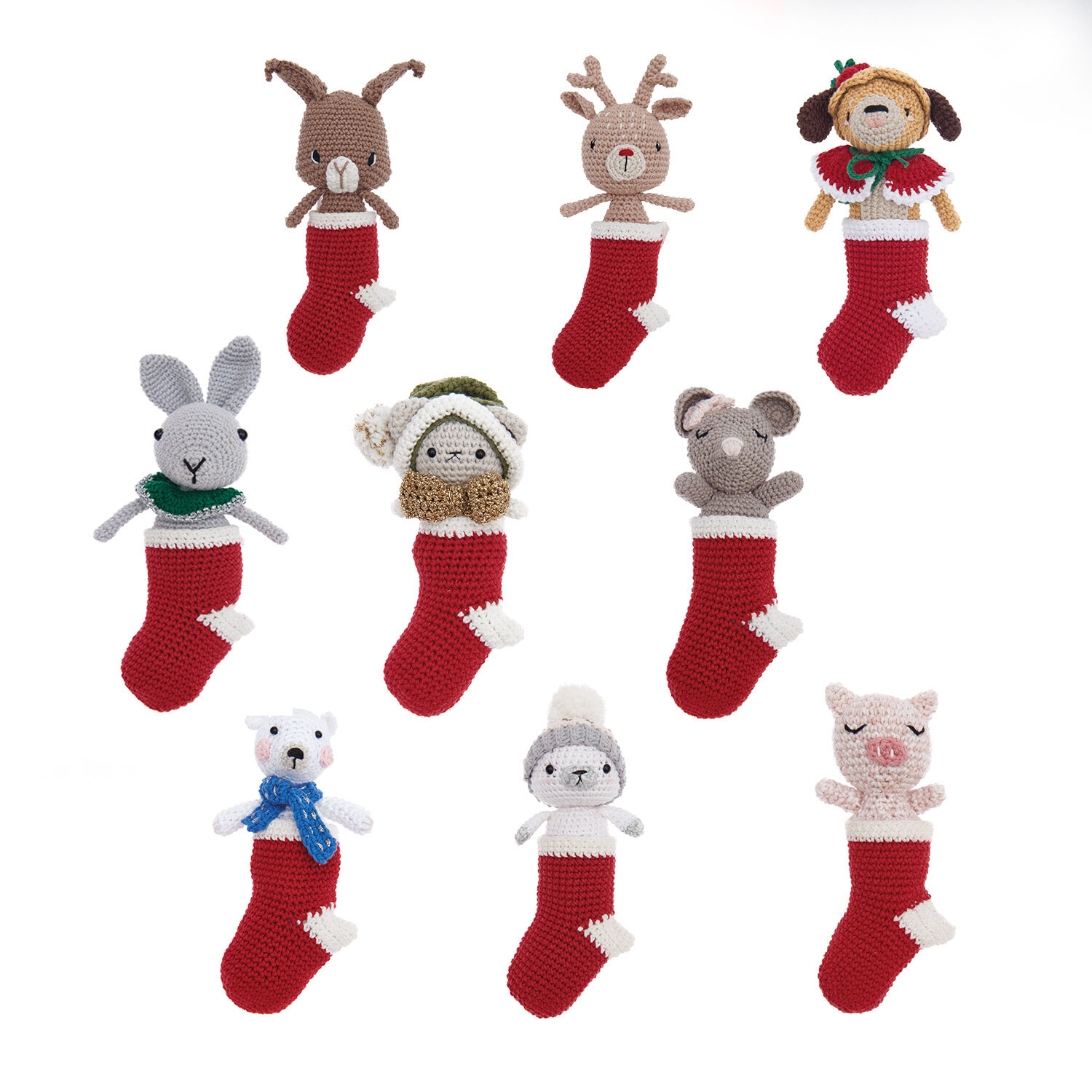 Creative Ricorumi dk Christmas CAL Box 1 zeigt gehäkelte Tiere in roten Strümpfen von Rico Design.