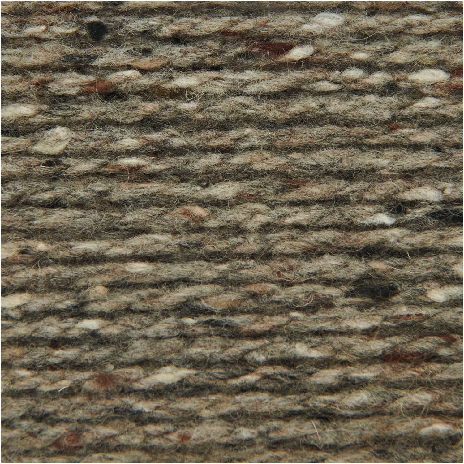 Fashion Modern Tweed aran: Nahaufnahme von anthrazitfarbenem Garn von Rico Design, 50g 95m. Ideal für Strickprojekte.