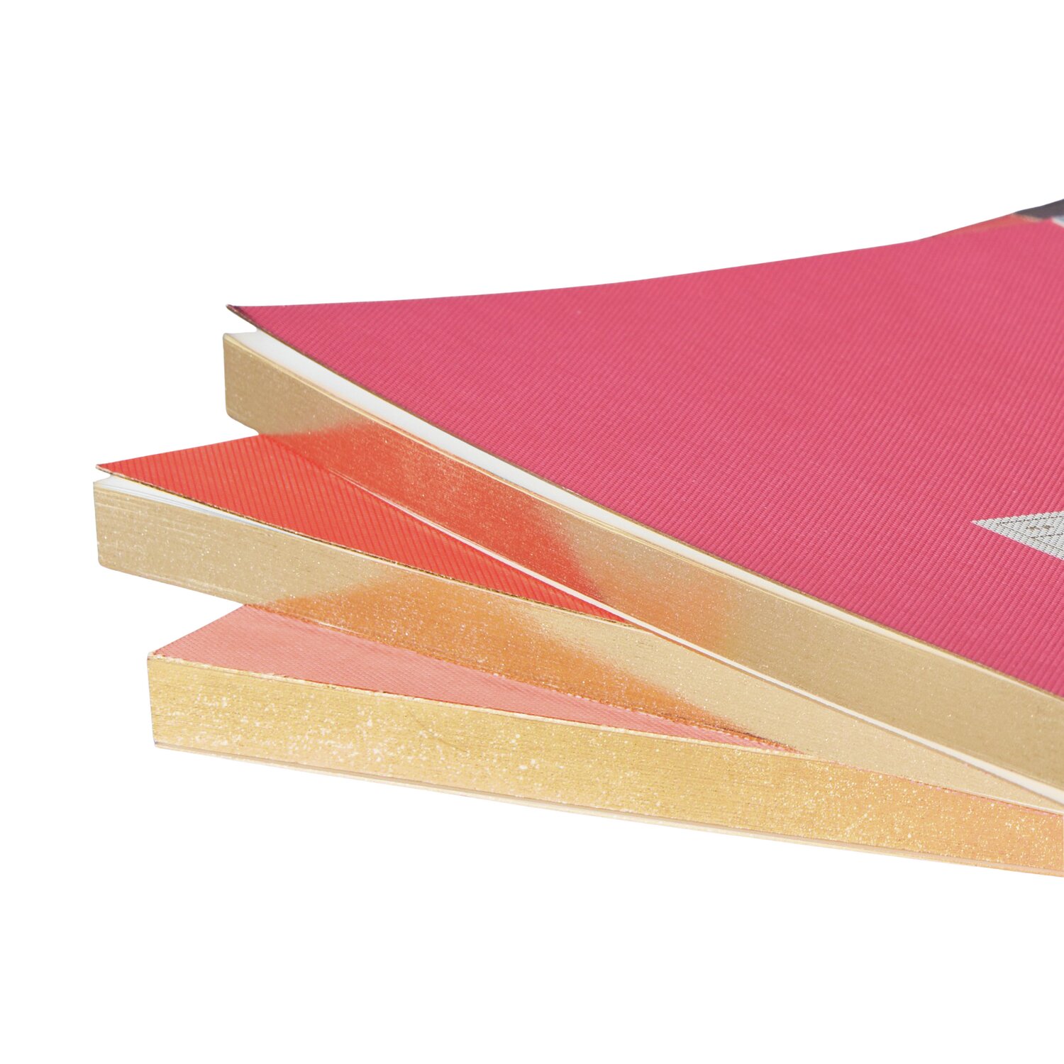 Paper Poetry Notizbuch S mit Goldrand und neonrotem Cover von Rico Design, gestapelt.