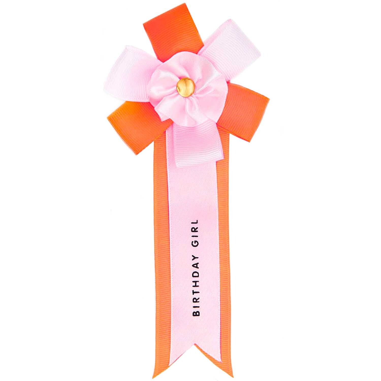 Rosette Birthday Girl: Eine dekorative Schleife in Rosa und Orange von Rico Design, ideal für Geburtstagsfeiern.