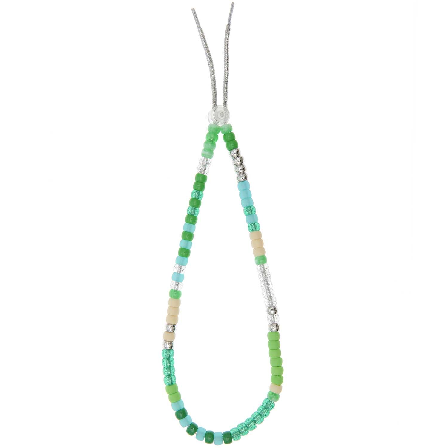 Itoshii - Ponii Beads in verschiedenen Grüntönen, aufgereiht auf einem Band, von Rico Design.
