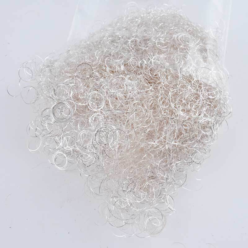 Lametta gelockt silber 25g: Eine Packung mit glänzendem, gelocktem Lametta in Silber von Preissler. Ideal für festliche Dekorationen.