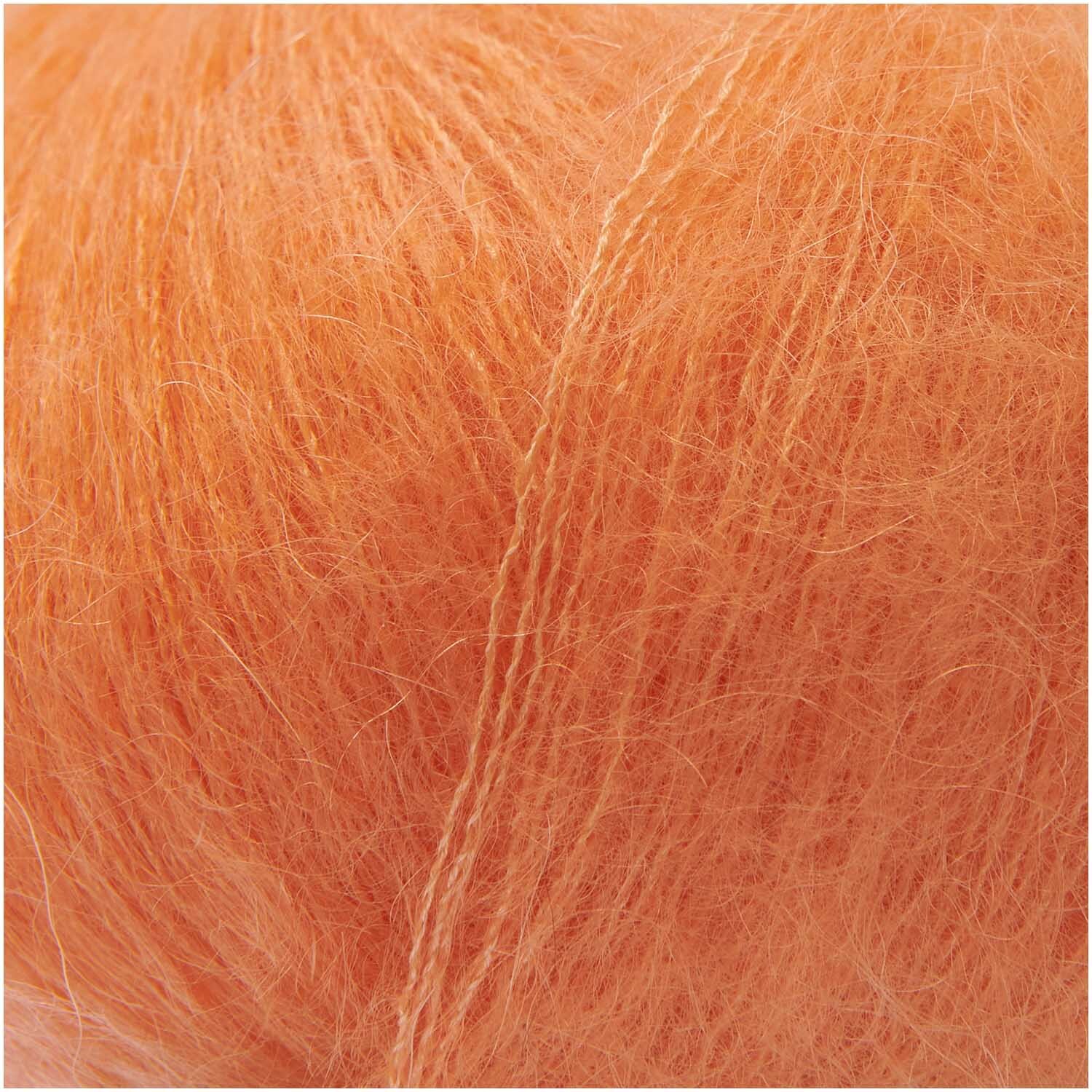 Essentials Super Kid Mohair Loves Silk in leuchtendem Mandarine von Rico Design, 25g Knäuel mit 200m Länge, ideal für weiche Strickprojekte.