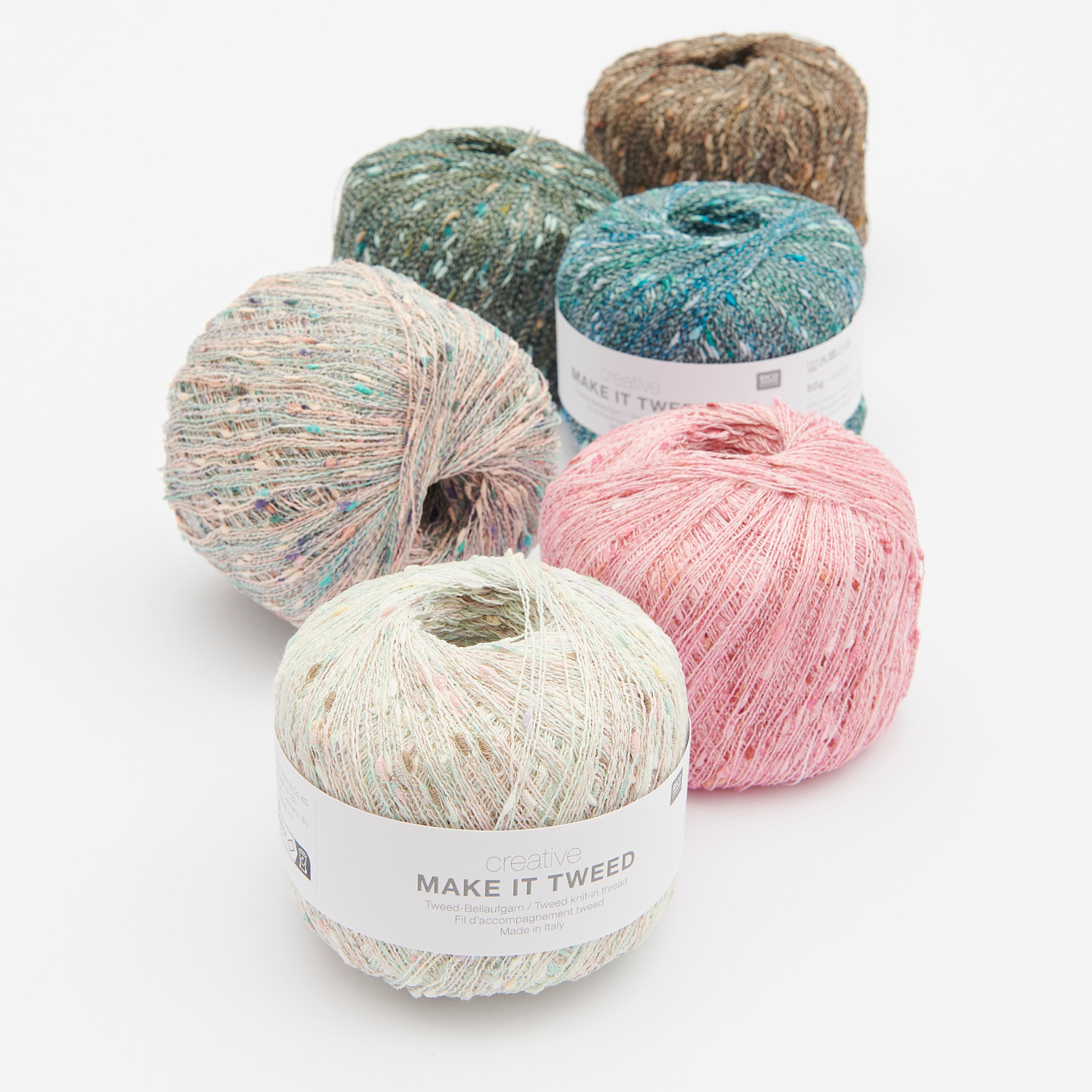 Creative Make It Tweed: Mehrfarbige Garnknäuel von Rico Design in verschiedenen Tönen, ideal für Strickprojekte.