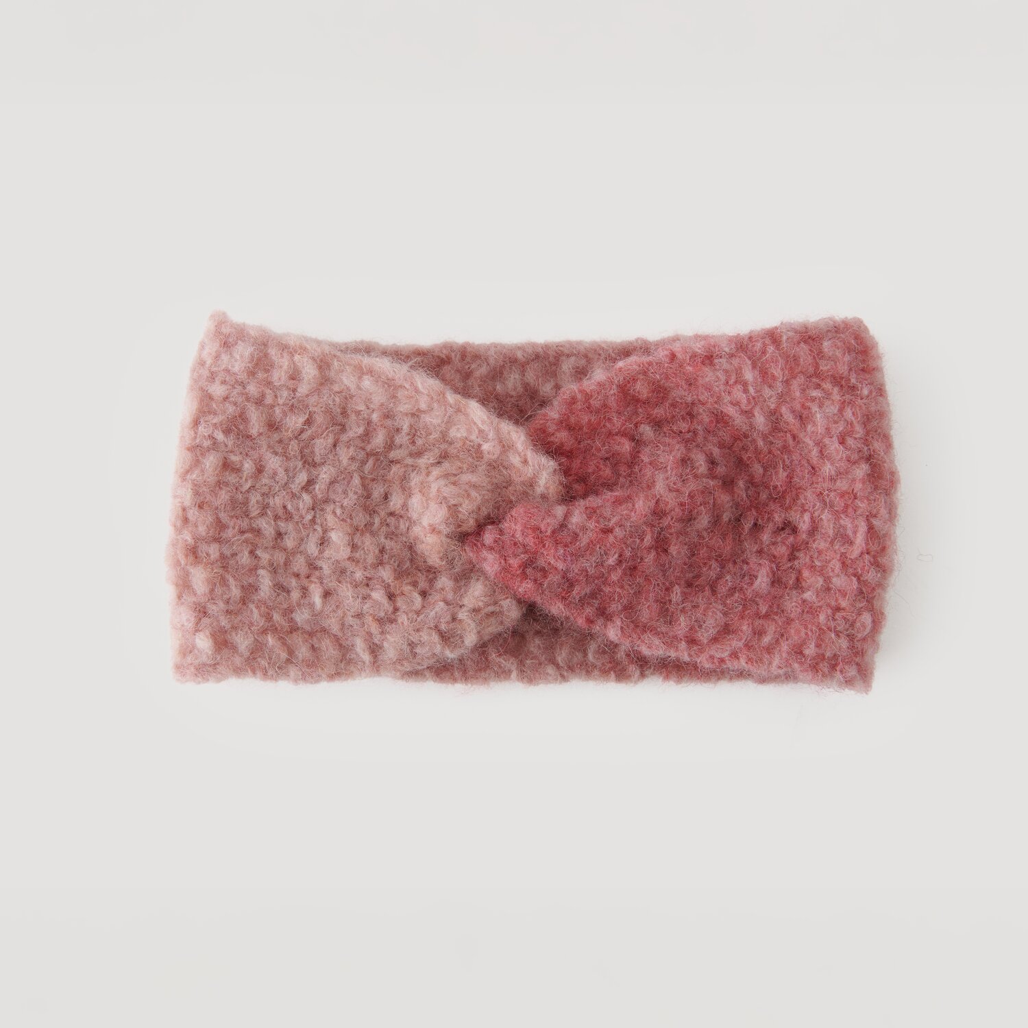 Stirnband aus weichem, rosa- und altrosa-farbenem Stoff, Modell Legeware. Ideal für kühle Tage, bietet es Komfort und Stil. Perfekt für modische Akzente im Alltag.