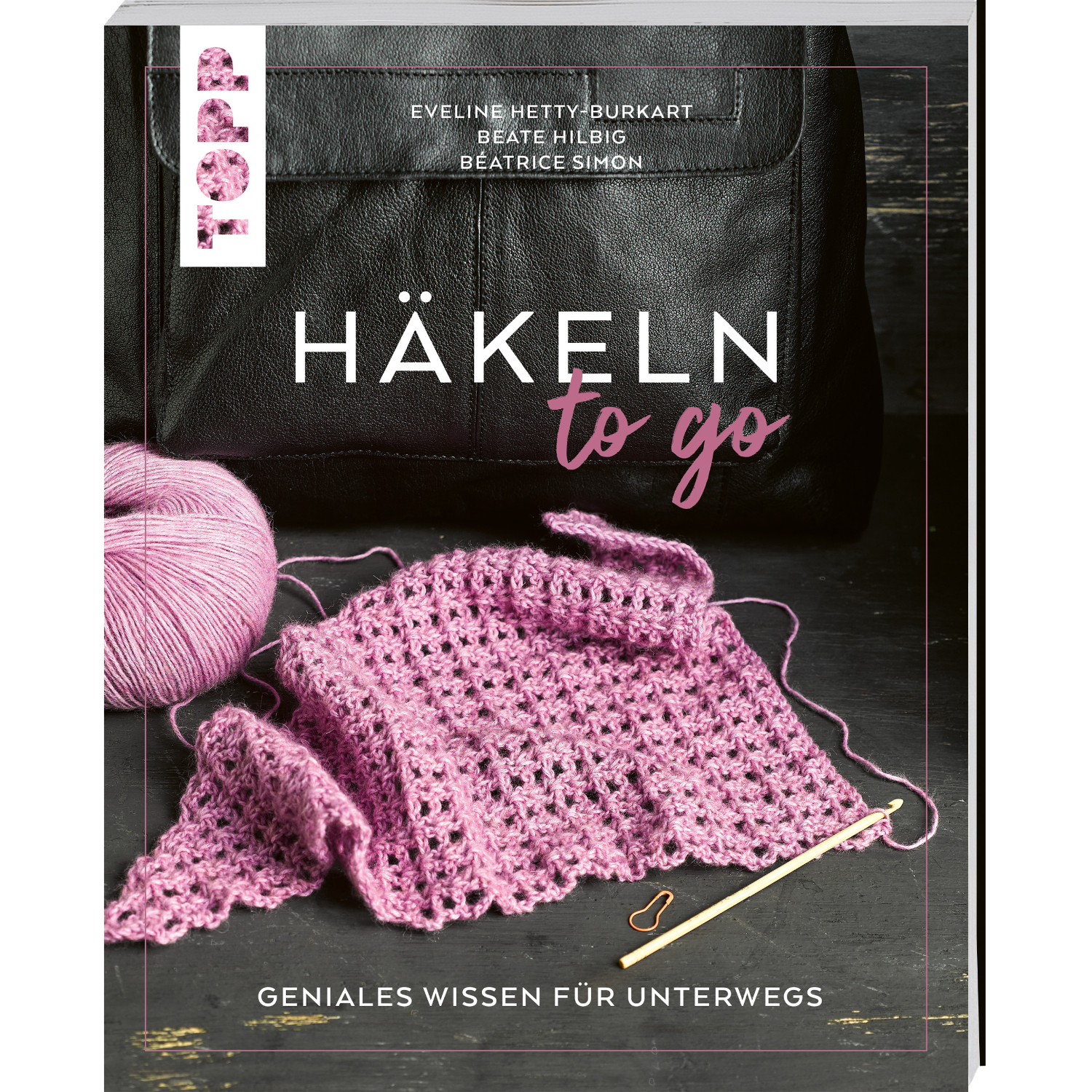 Häkeln to go – Geniales Wissen für unterwegs: Buchcover mit rosa Häkelarbeit und schwarzer Tasche.