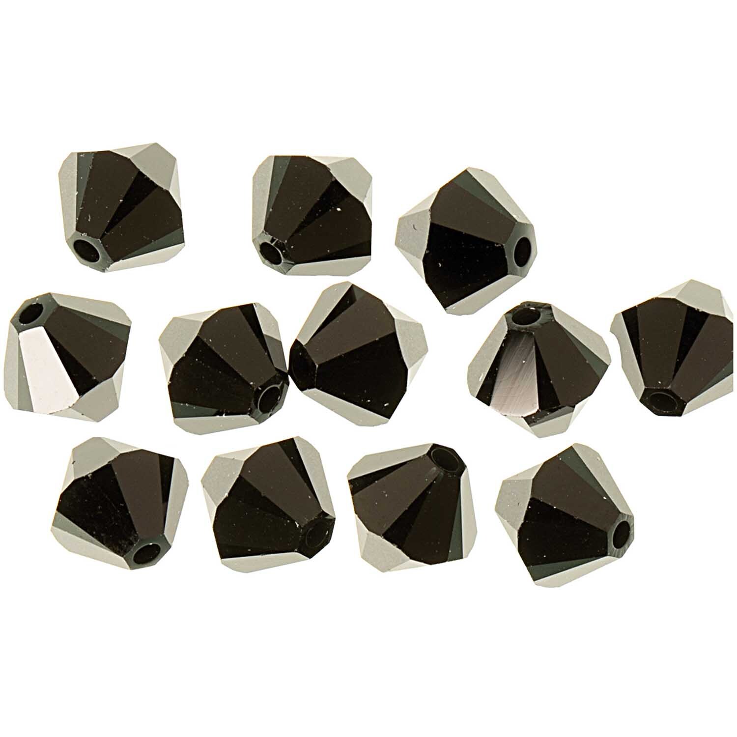 Glasschliff-Perle jet 6mm von Rico Design, 12 schwarze facettierte Perlen auf weißem Hintergrund.