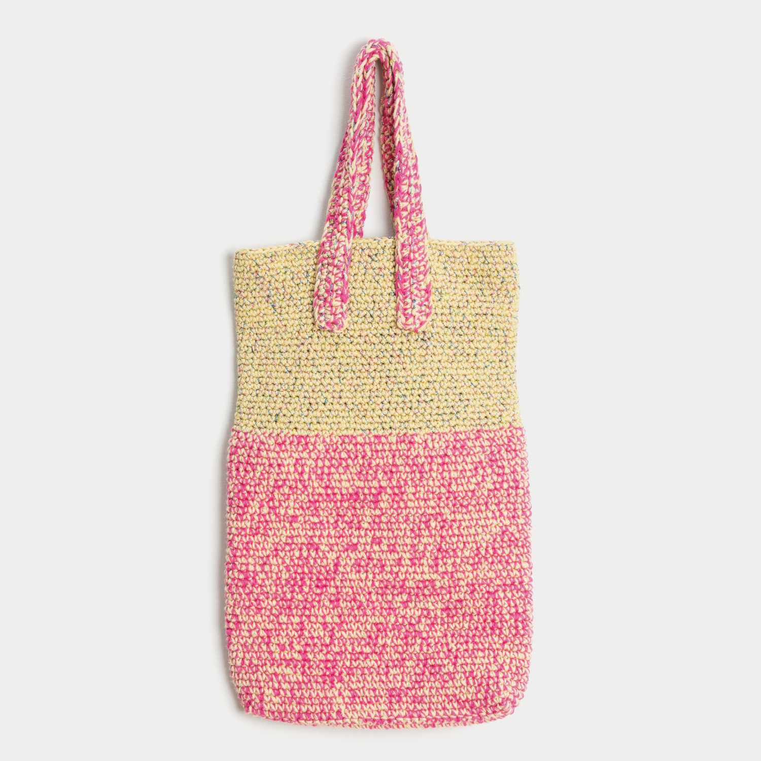 Häkelanleitung Tasche mit funkelndem Beilaufgarn: Eine zweifarbige Tasche in Beige und Pink mit langen Henkeln, ideal für den Alltag.