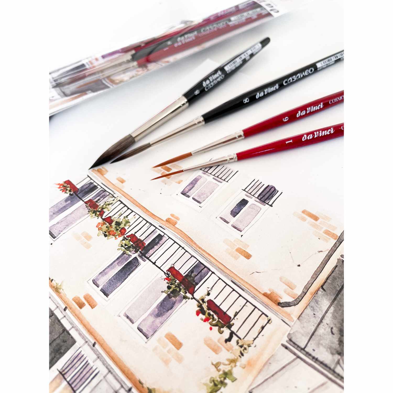 da Vinci Pinsel-Set Urban Watercolor Schlepper Crew mit roten und schwarzen Pinseln auf einem Aquarellbild. Ideal für kreative Künstler.