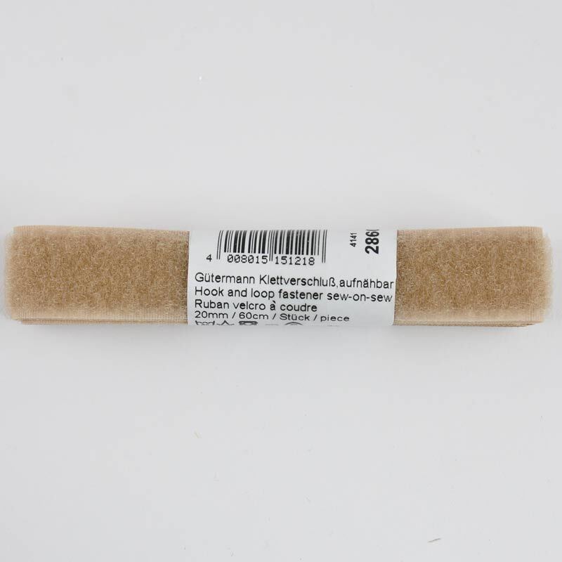 Klettverschluss beige 20mm 60cm von Gütermann, aufgerollt mit Etikett auf weißem Hintergrund.