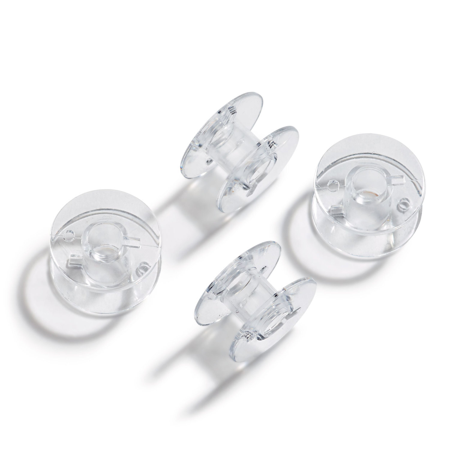 Nähmaschinenspulen CB-Greifer von Prym, transparent, 20,5mm, 4 Stück, auf weißem Hintergrund.