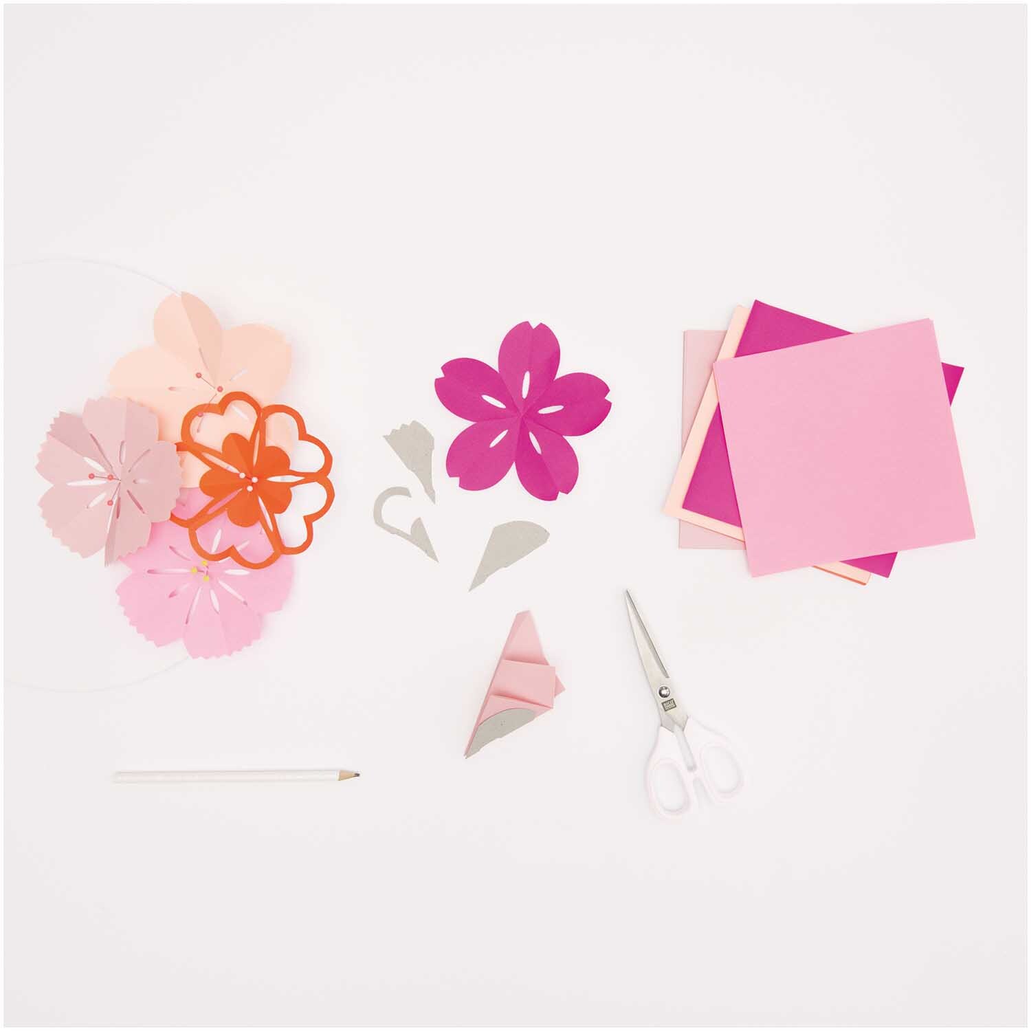 Paper Poetry Origami Blumen-Set mit rosa und pinken Blättern, Schablonen und Schere.