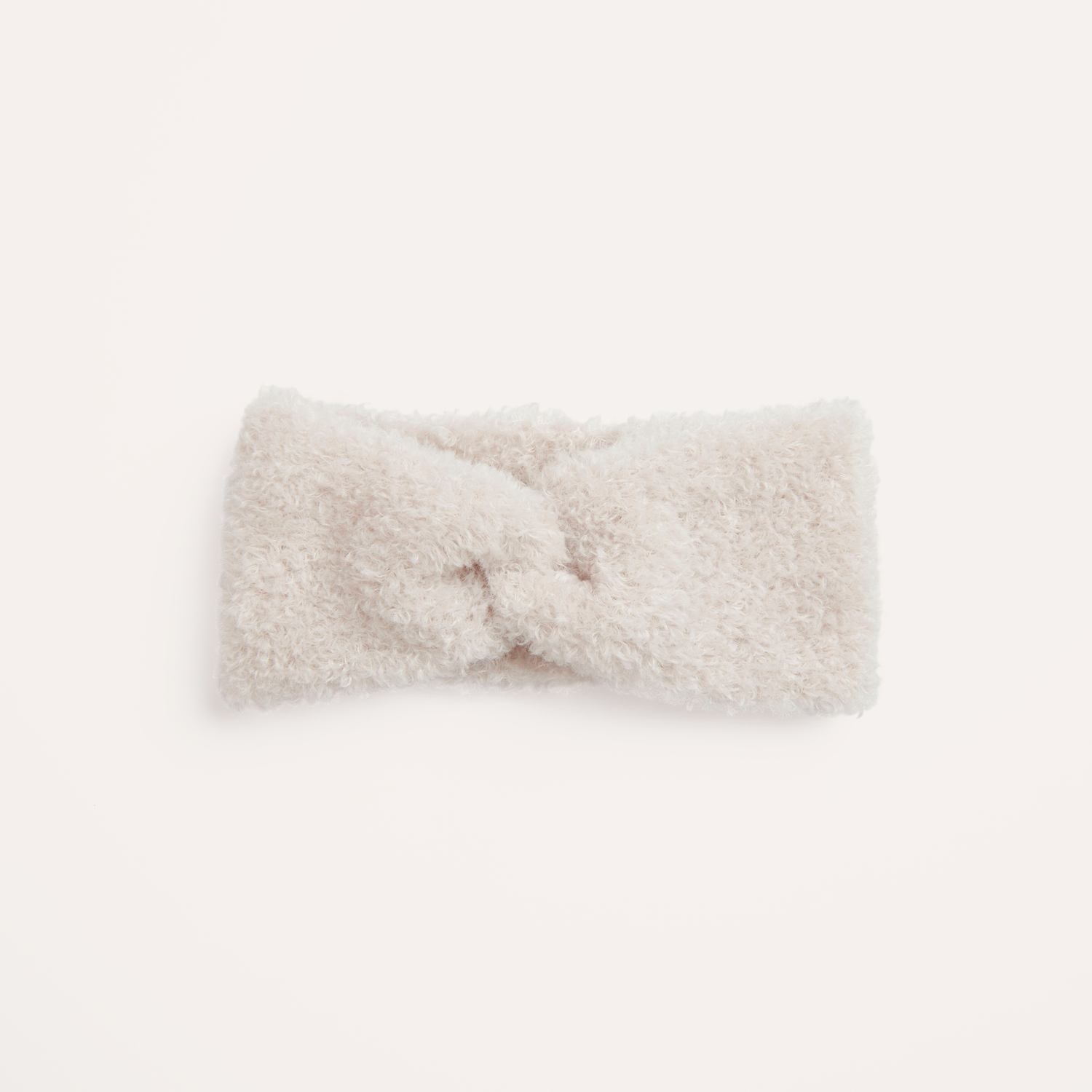 Strickanleitung Twist Stirnband aus Creative Teddy: Flauschiges, cremefarbenes Stirnband mit Twist-Design. Ideal für kalte Tage.