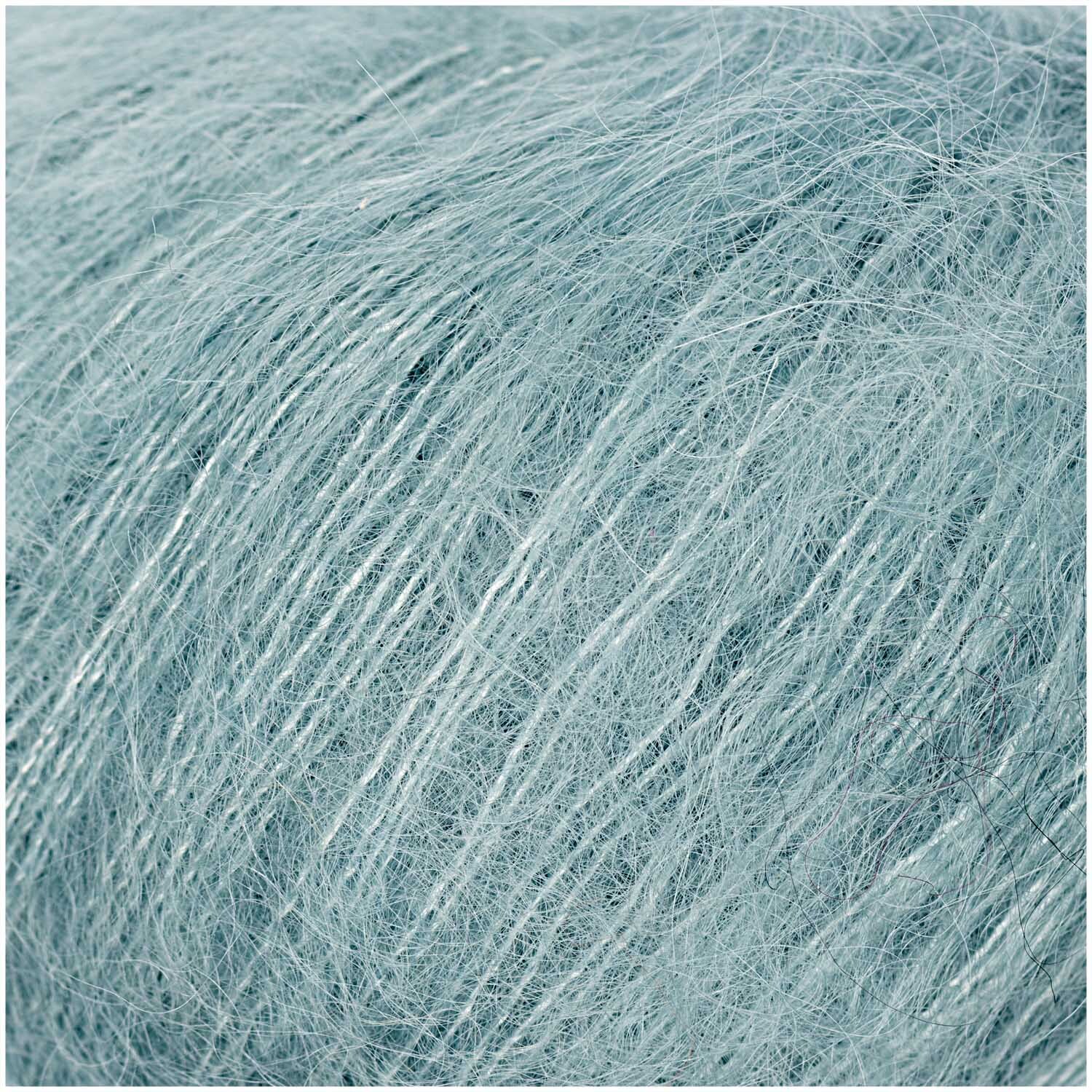 Essentials Super Kid Mohair Loves Silk: Weiches, aquafarbenes Garn von Rico Design, ideal für leichte Strickprojekte.