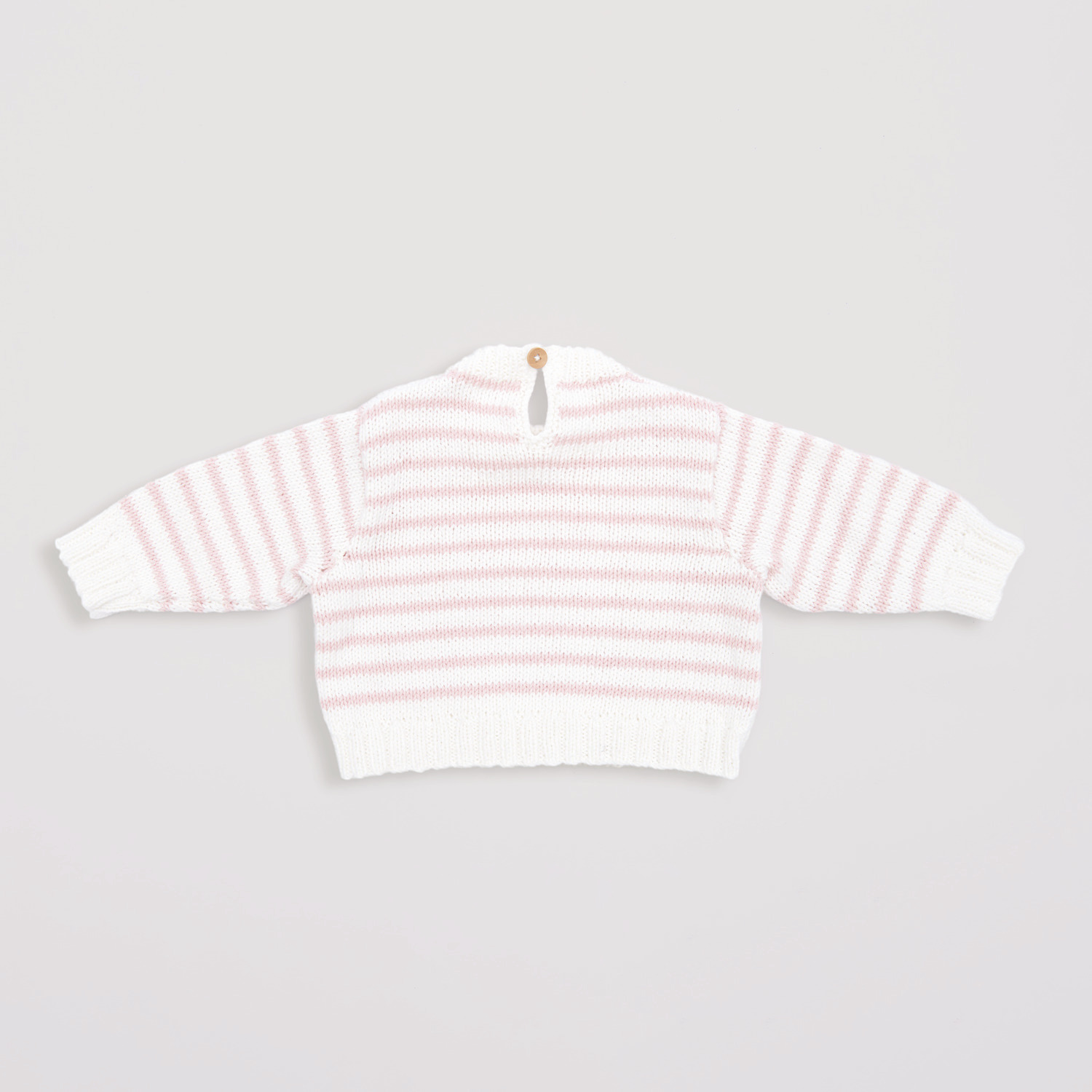 Baby Organic Cotton Pullover in Rosa und Weiß, gestrickt aus weicher Bio-Baumwolle, ideal für empfindliche Babyhaut.