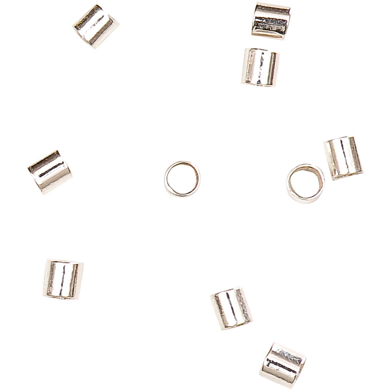 Quetschröhrchen 1,5mm aus 925er Silber von Rico Design, 20 Stück. Zeigt silberne Röhrchen auf weißem Hintergrund.